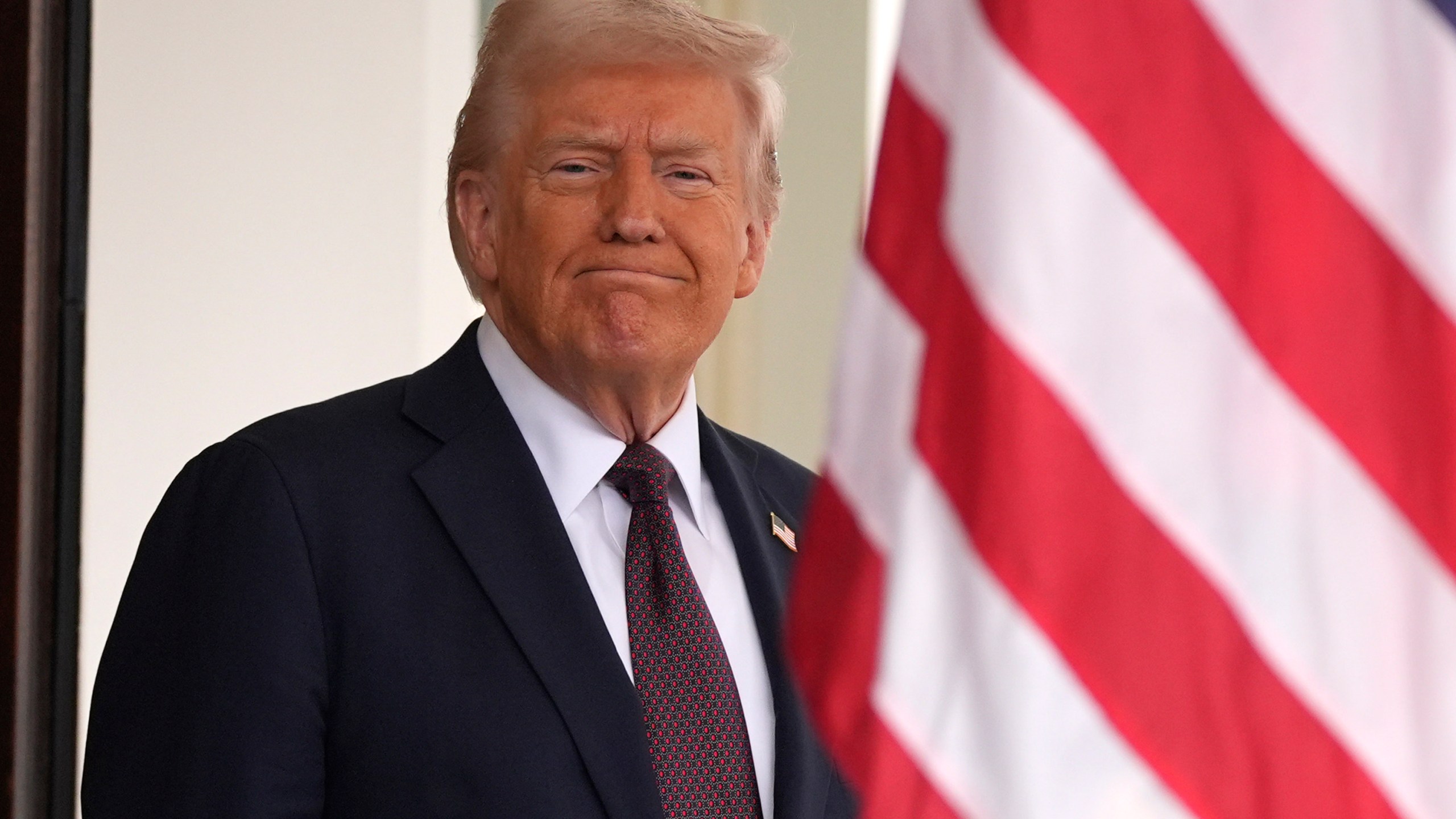 President Donald Trump stands before British Prime Minister Keir Starmer arrives at the White House, Thursday, Feb. 27, 2025, in Washington. (AP Photo/Evan Vucci)