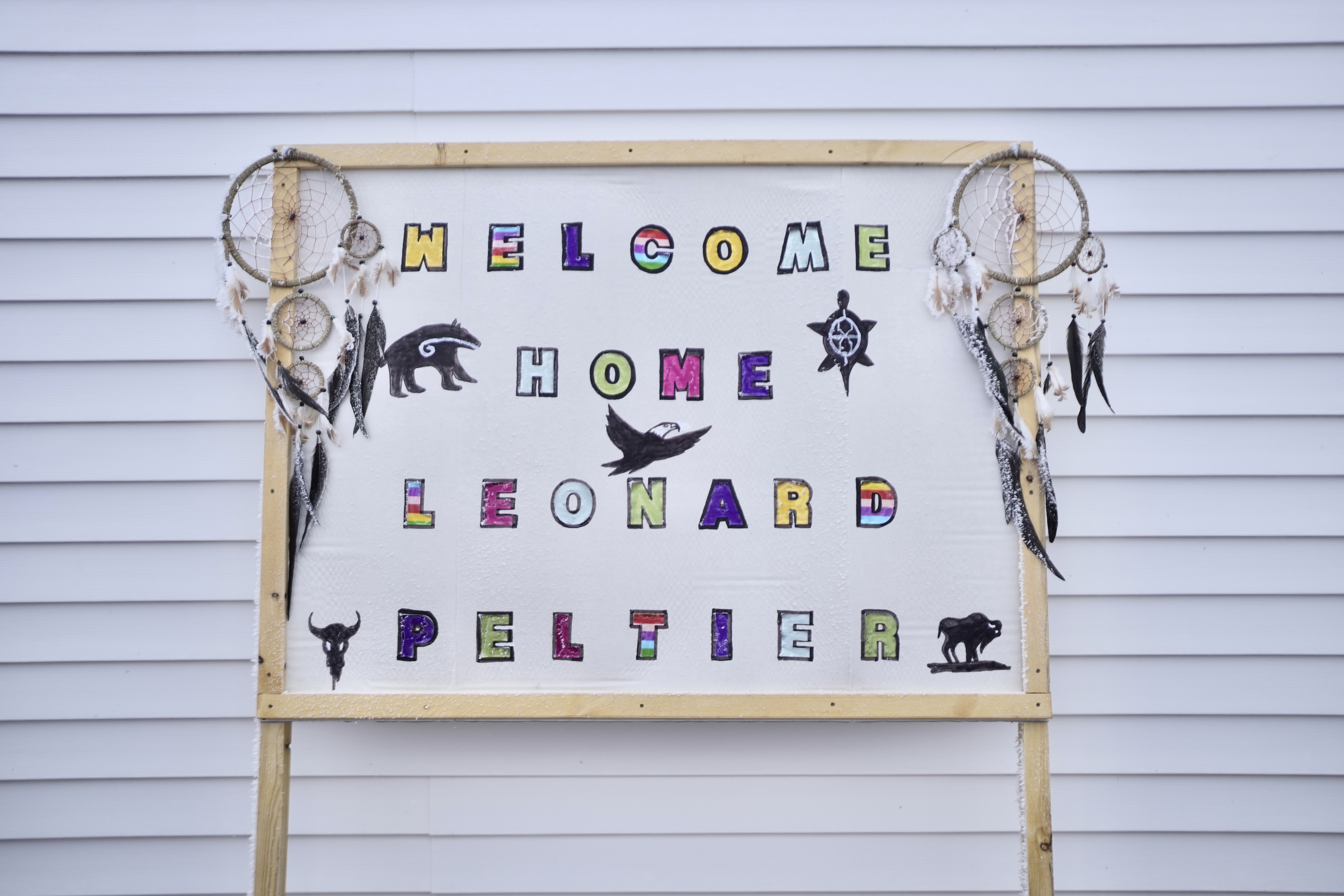 A "Welcome Home" sign is displayed for Leonard Peltier in Belcourt, N.D, on Tuesday, Feb. 25, 2025. (AP Photo/Mark Vancleave)