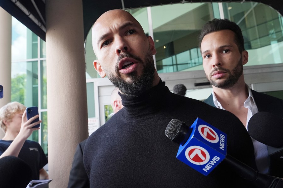 Influencer brothers Andrew and Tristan Tate arrive, Thursday, Feb. 27, 2025, in Fort Lauderdale, Fla. The brothers were charged with human trafficking in Romania and arrived in the U.S. after authorities lifted travel restrictions. (AP Photo/Marta Lavandier)