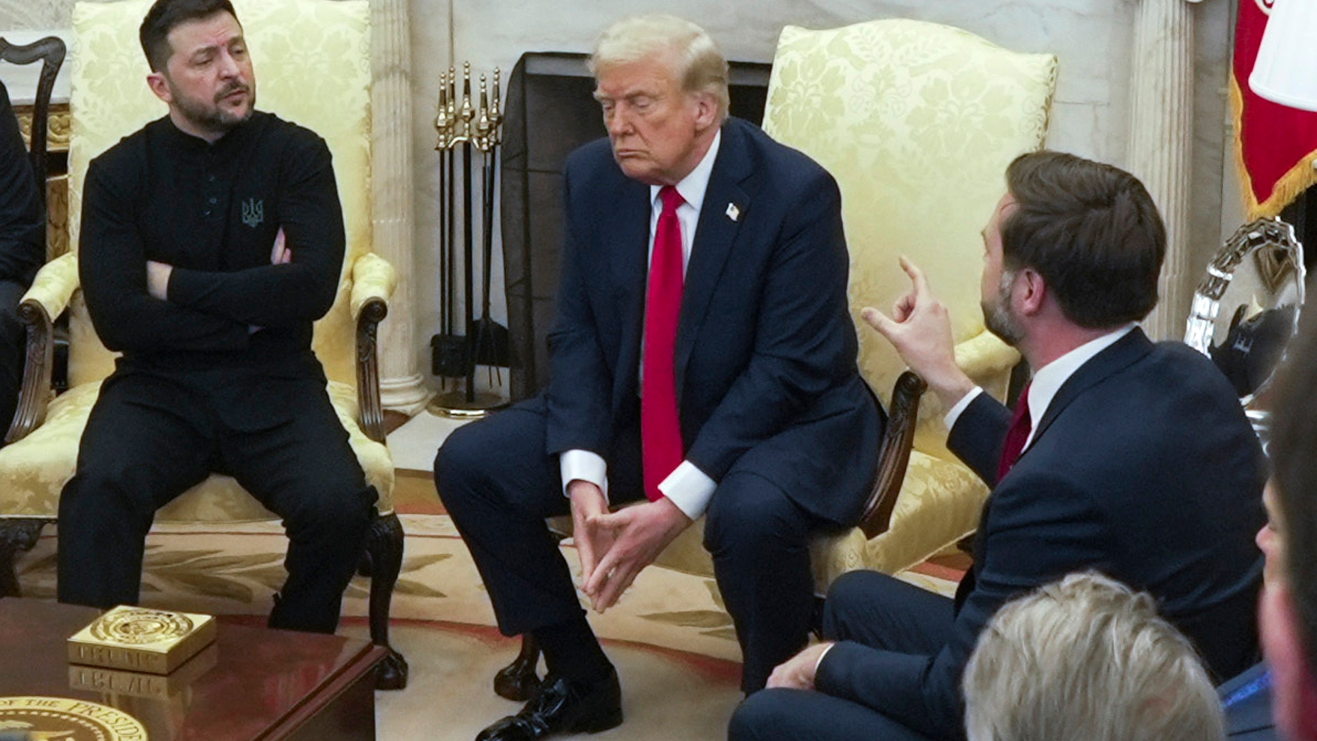 Vice President JD Vance, right, speaks with Ukrainian President Volodymyr Zelenskyy, left, as President Donald Trump listens in the Oval Office at the White House, Friday, Feb. 28, 2025, in Washington. (AP Photo/ Mystyslav Chernov)