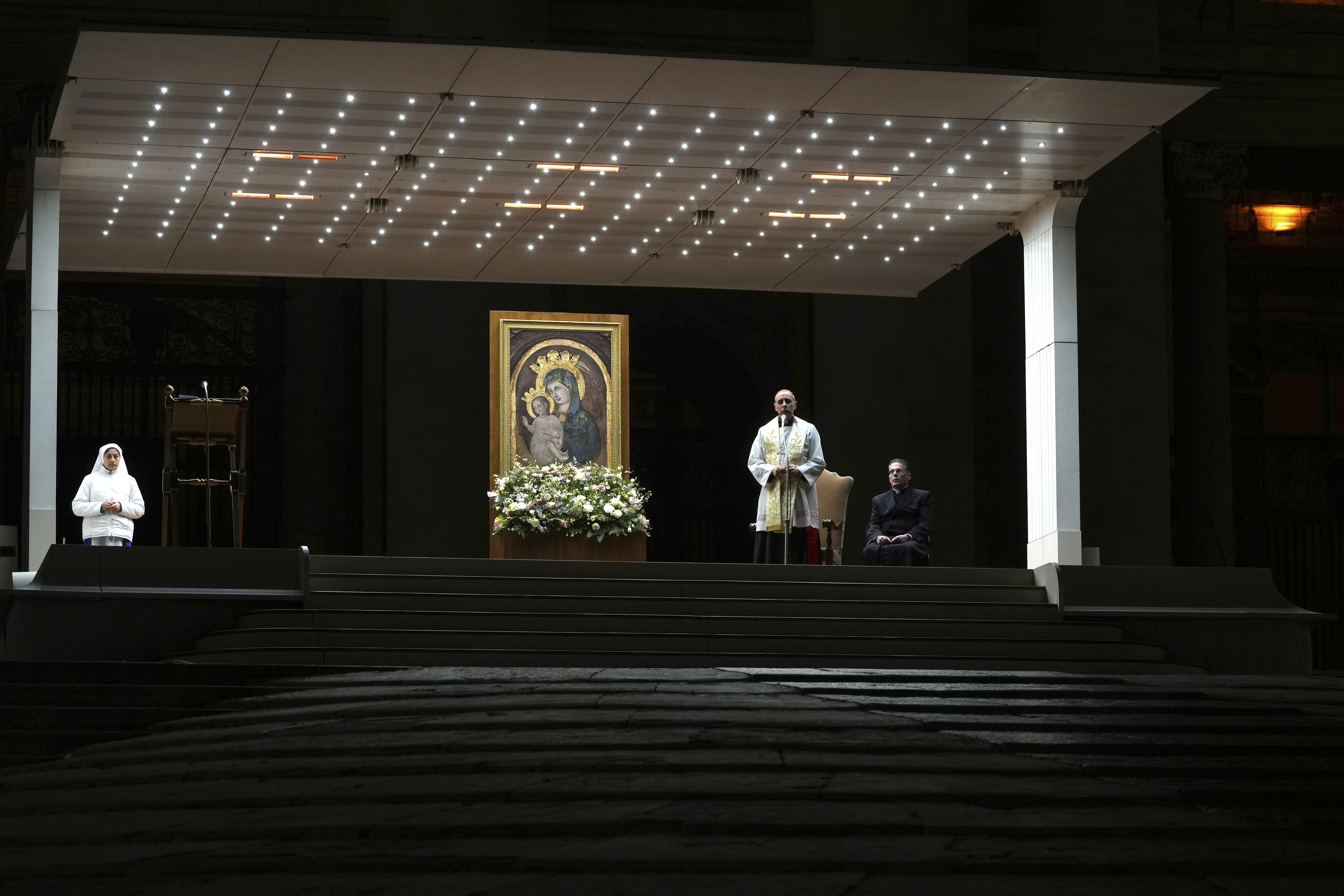 Cardinal Victor Manuel Fernandez, second right, prays during a rosary prayer held for the health of Pope Francis in St Peter's Square at The Vatican, Friday, Feb. 28, 2025. (AP Photo/Kirsty Wigglesworth)