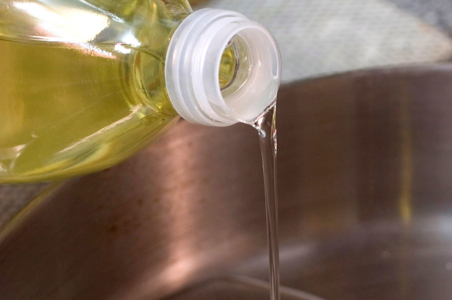 FILE - Canola oil is poured into a pan in Concord, N.H., on March 27, 2007. (AP Photo/Larry Crowe, File)