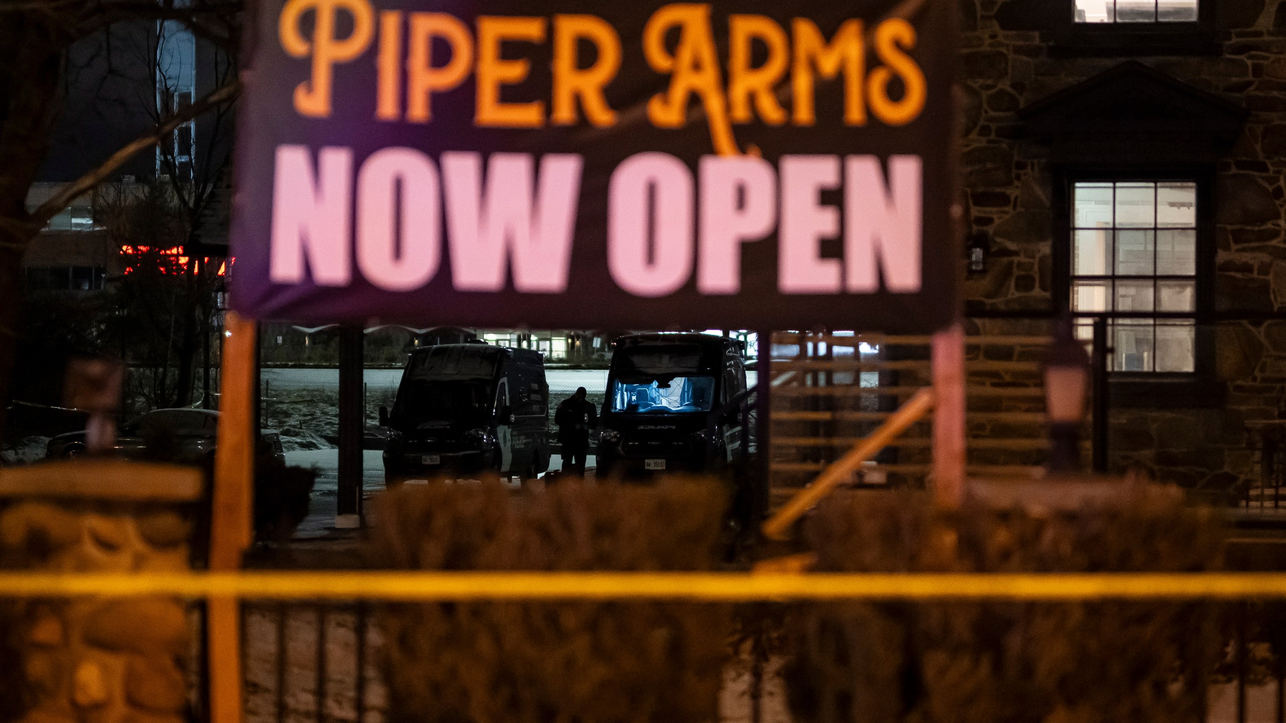 Toronto Police investigate a shooting at the Piper Arms Pub near the Scarborough Town Centre in Toronto on Saturday, March 8, 2025. (Christopher Katsarov/The Canadian Press via AP)