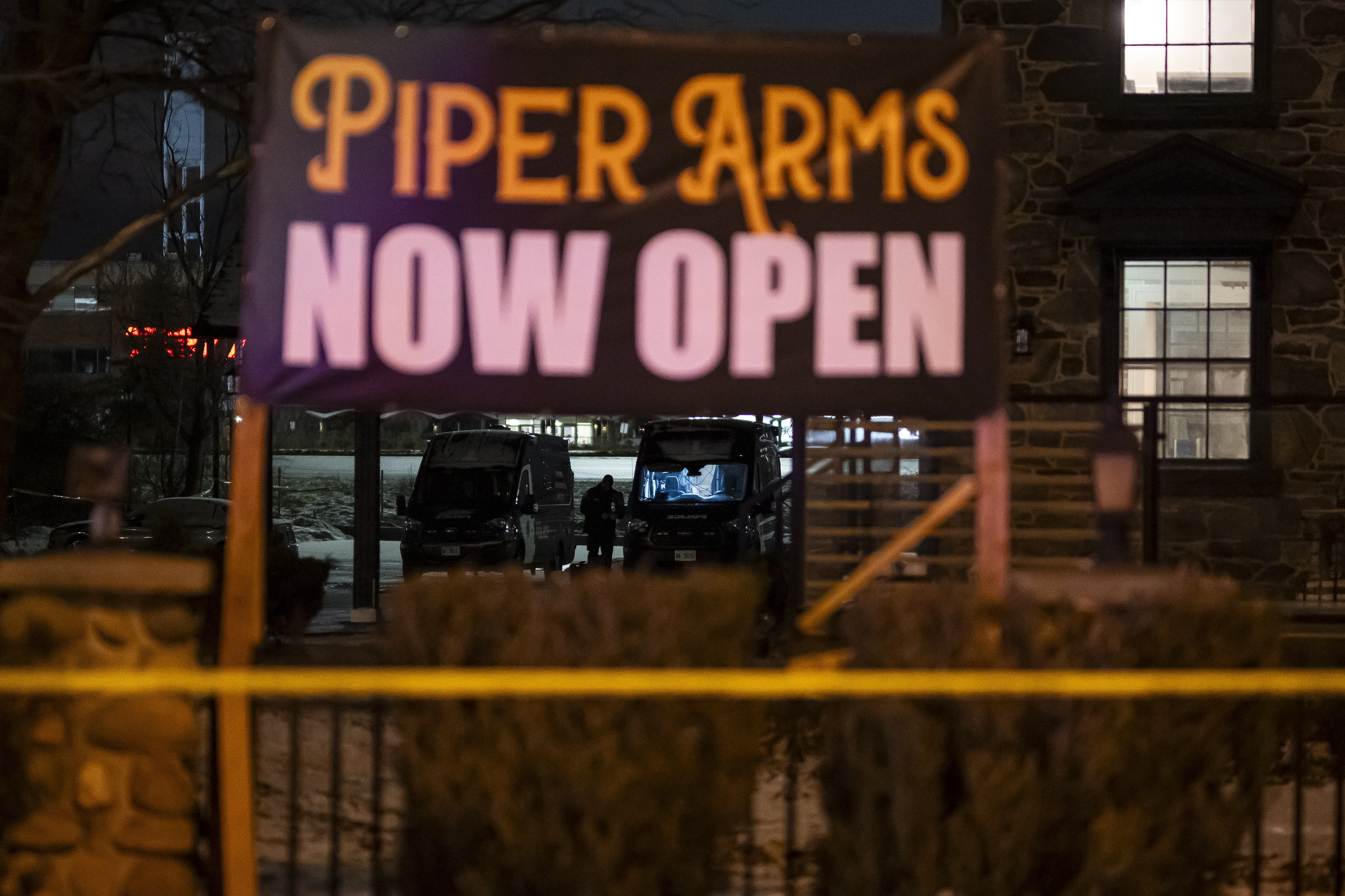 Toronto Police investigate a shooting at the Piper Arms Pub near the Scarborough Town Centre in Toronto on Saturday, March 8, 2025. (Christopher Katsarov/The Canadian Press via AP)