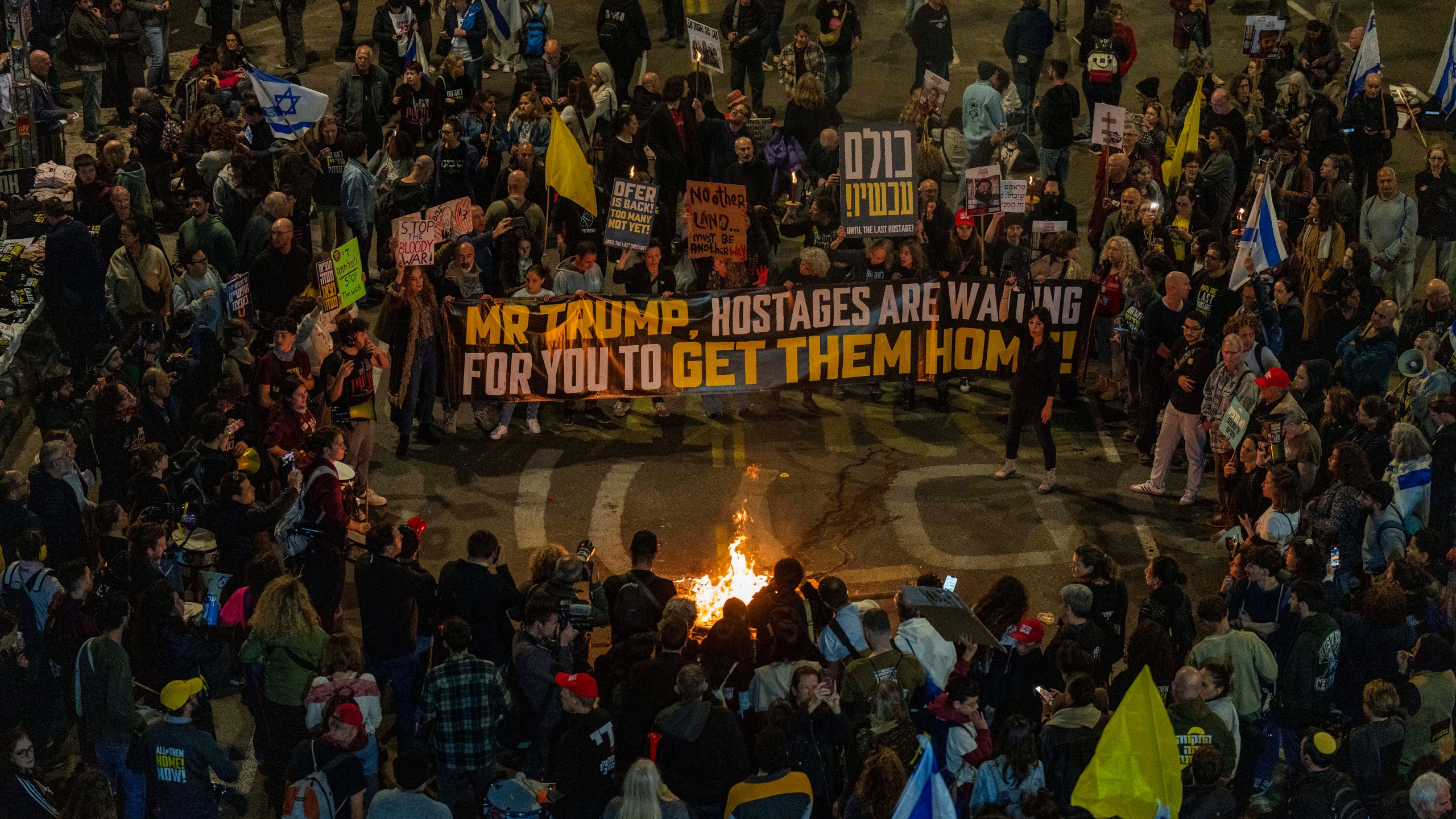 People take part in a protest in Tel Aviv, Israel, Saturday, March 8, 2025, demanding the immediate release of hostages held by Hamas in the Gaza Strip. (AP Photo/Ariel Schalit)