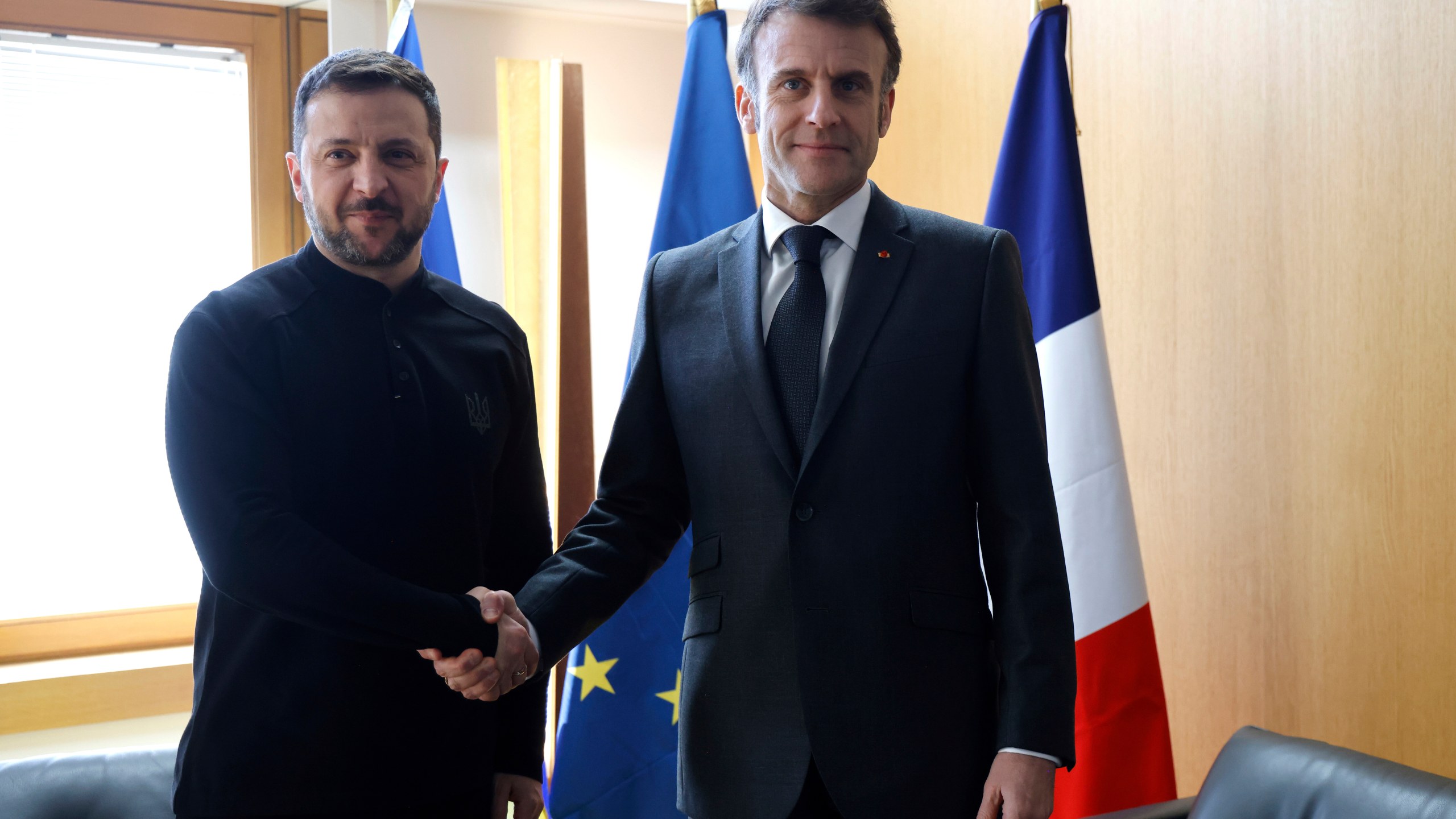 Ukraine's President Volodymyr Zelenskyy, left, meets French President Emmanuel Macron on the sidelines of the European Council to discuss continued support for Ukraine and European defense, in Brussels, Thursday, March 6, 2025. (Ludovic Marin, Pool via AP)