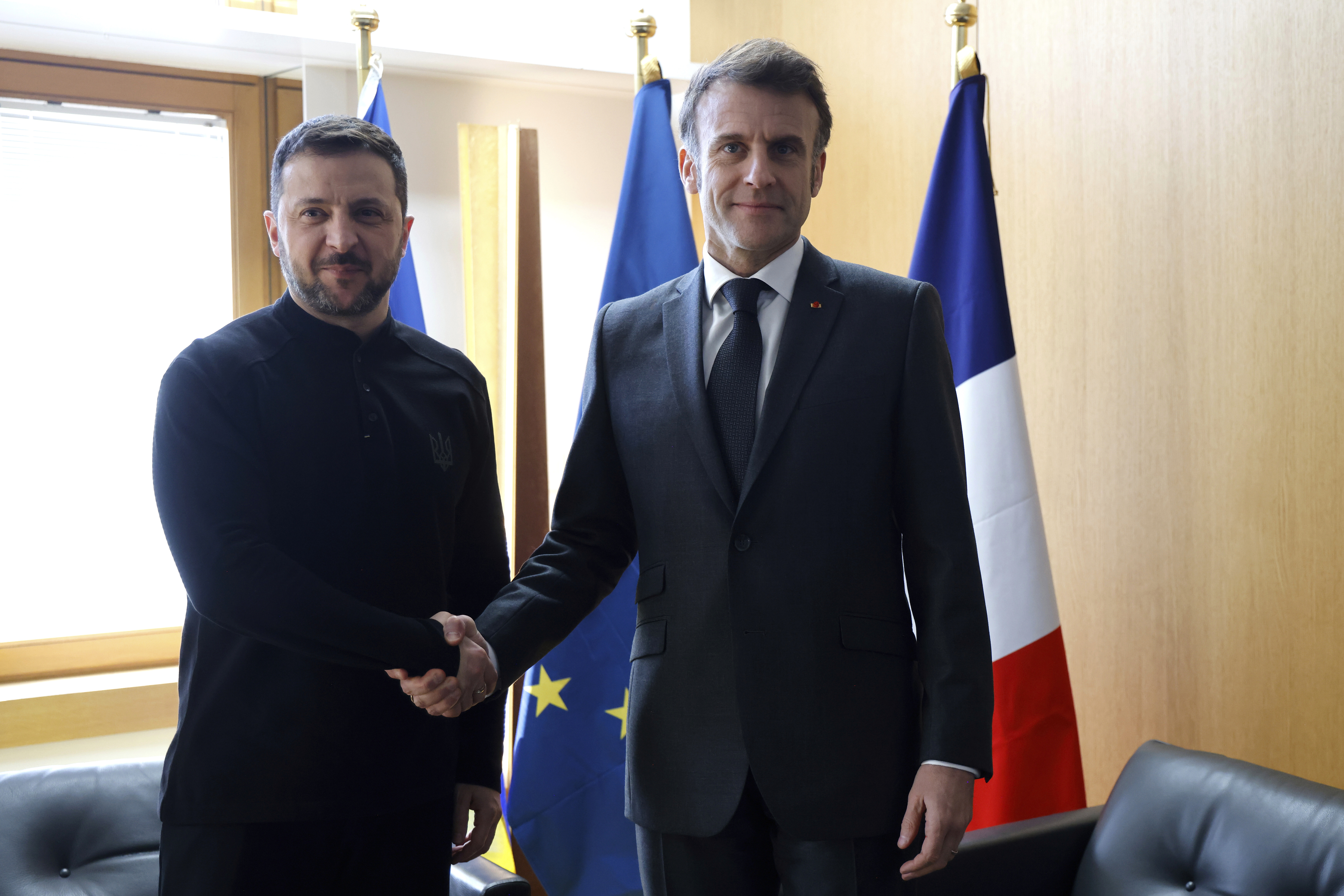 Ukraine's President Volodymyr Zelenskyy, left, meets French President Emmanuel Macron on the sidelines of the European Council to discuss continued support for Ukraine and European defense, in Brussels, Thursday, March 6, 2025. (Ludovic Marin, Pool via AP)