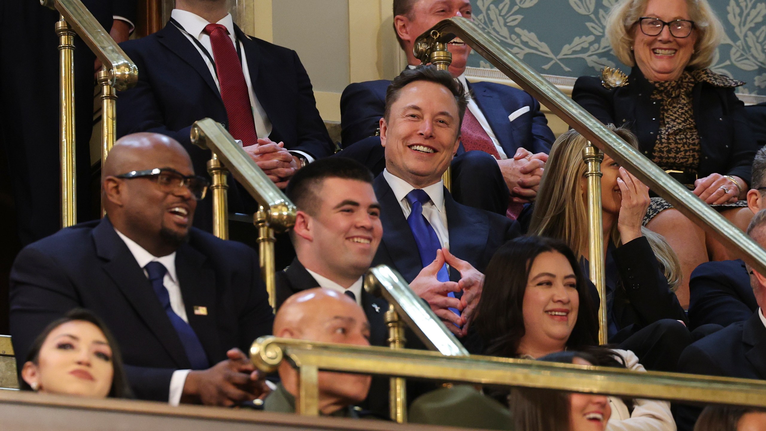 Elon Musk, center, listens as President Donald Trump addresses a joint session of Congress at the Capitol in Washington, Tuesday, March 4, 2025. (Win McNamee/Pool Photo via AP)