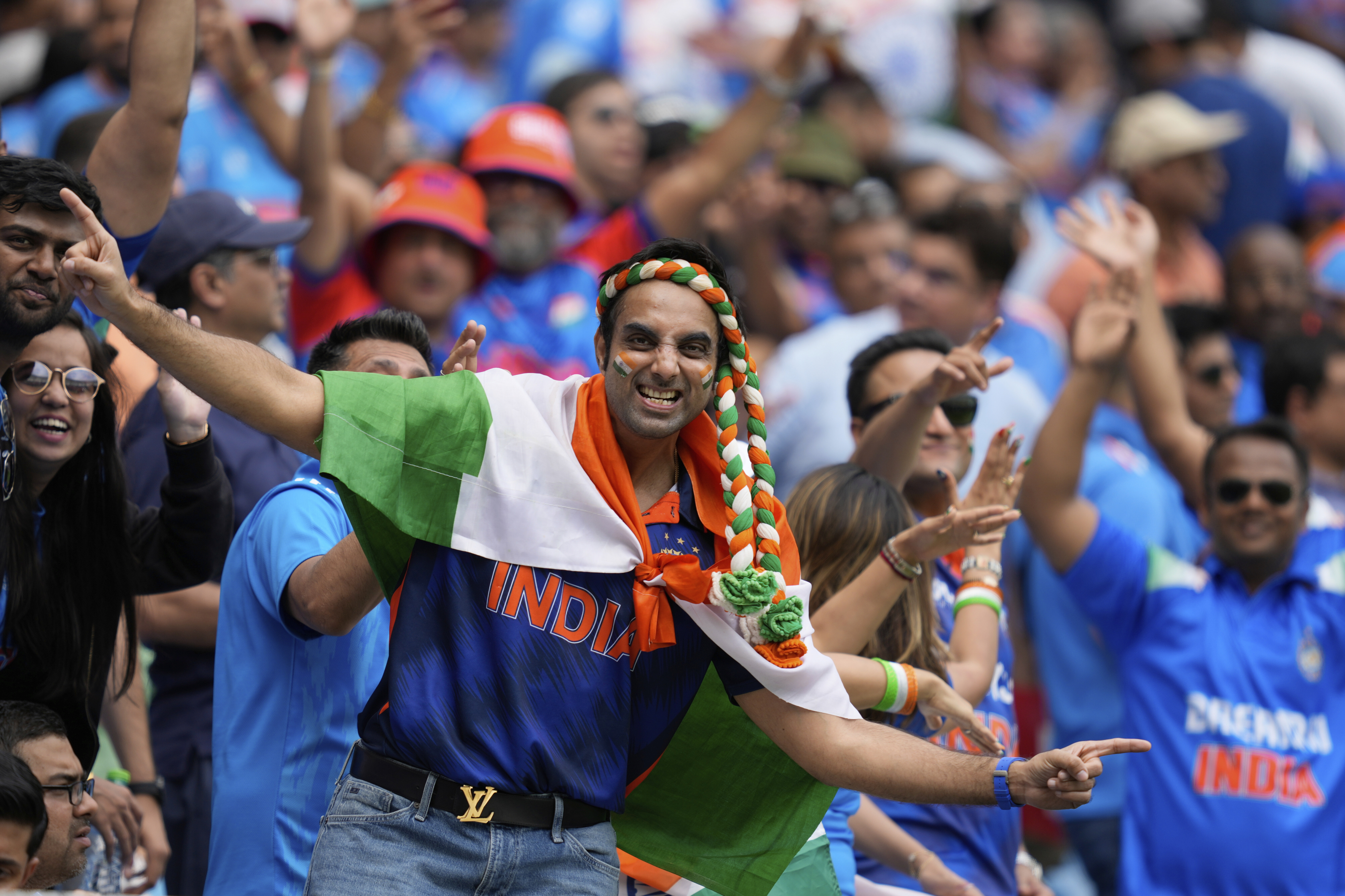 Indian fans cheer for their team prior to the start of the ICC Champions Trophy final cricket match between India and New Zealand at Dubai International Cricket Stadium in Dubai, United Arab Emirates, Sunday, March 9, 2025. (AP Photo/Altaf Qadri)