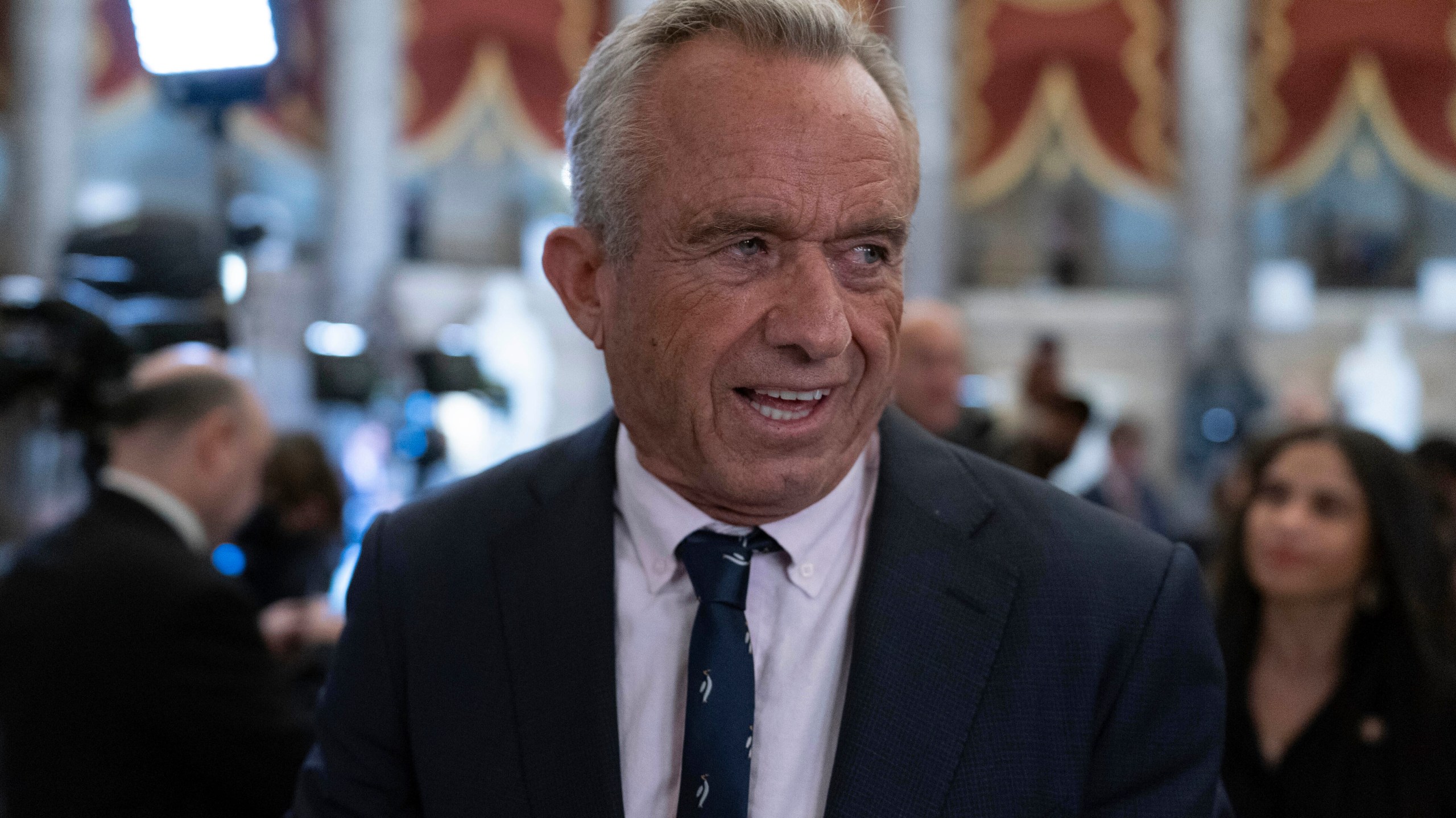 Secretary of Health and Human Services Robert F. Kennedy Jr. walks to the House Chamber before President Donald Trump addresses to a joint session of Congress at the Capitol in Washington, Tuesday, March 4, 2025. (AP Photo/Jose Luis Magana)