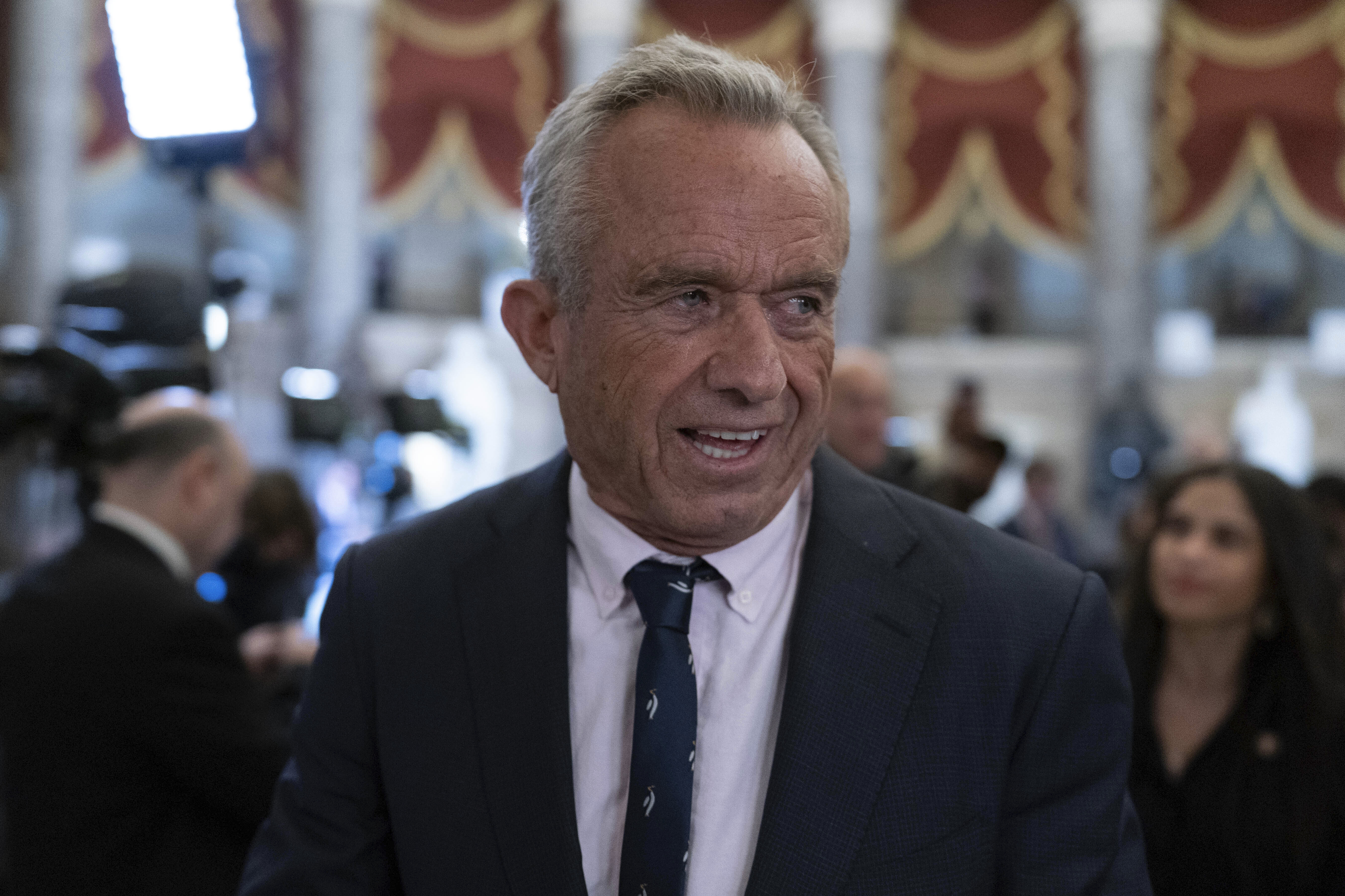 Secretary of Health and Human Services Robert F. Kennedy Jr. walks to the House Chamber before President Donald Trump addresses to a joint session of Congress at the Capitol in Washington, Tuesday, March 4, 2025. (AP Photo/Jose Luis Magana)