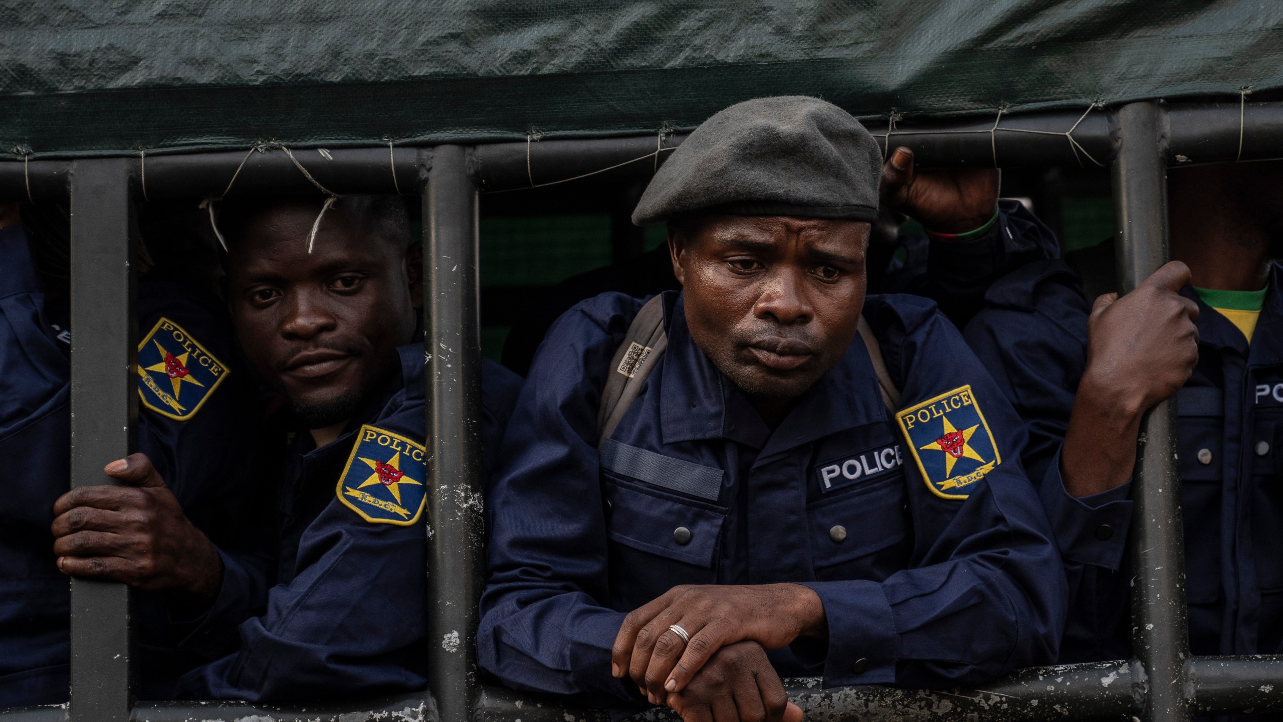 Former members of the Armed Forces of the Democratic Republic of Congo (FARDC) and police officers who allegedly surrendered to M23 rebels arrive in Goma, Congo, Sunday, Feb. 23, 2025. (AP Photo/Moses Sawasawa)