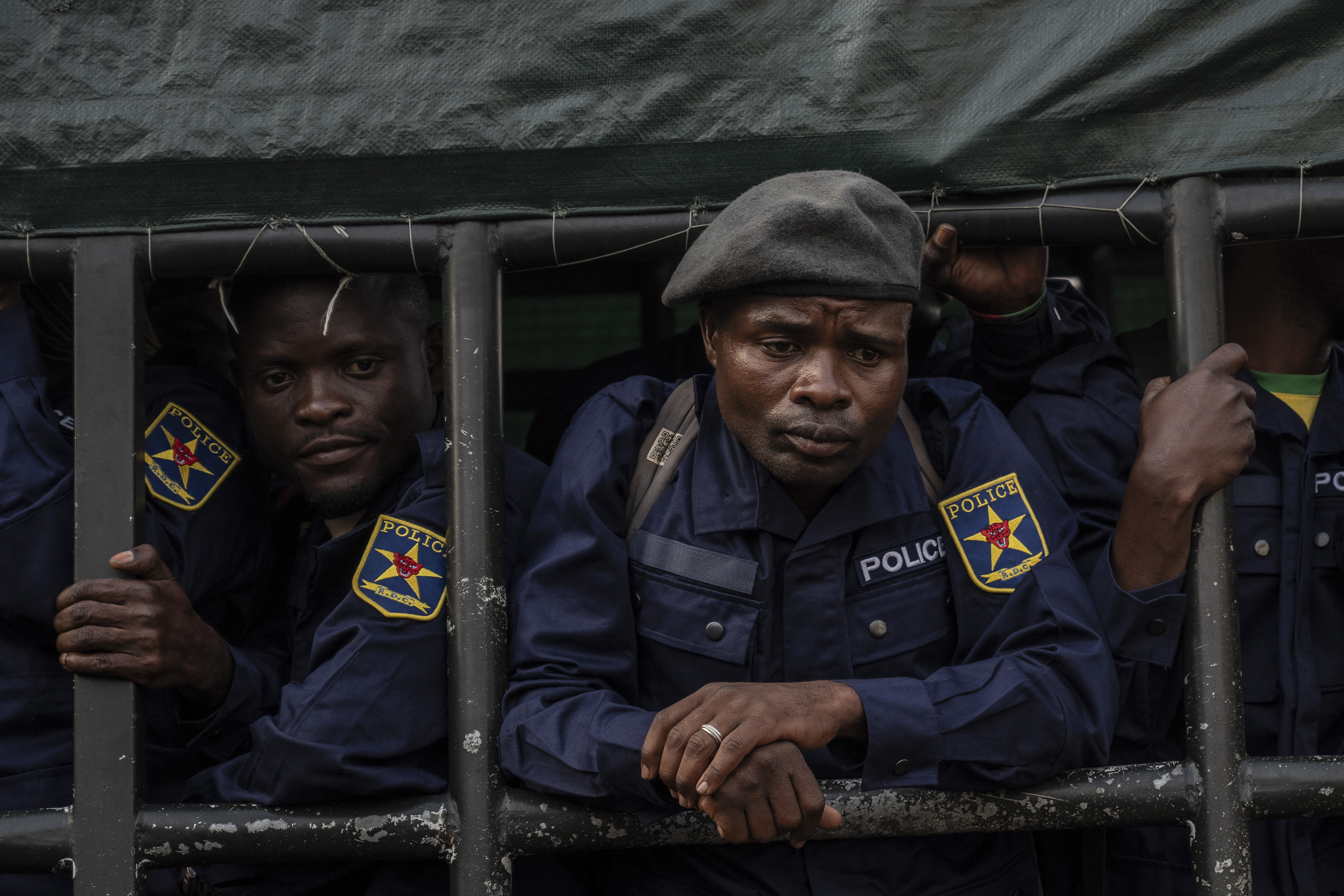 Former members of the Armed Forces of the Democratic Republic of Congo (FARDC) and police officers who allegedly surrendered to M23 rebels arrive in Goma, Congo, Sunday, Feb. 23, 2025. (AP Photo/Moses Sawasawa)