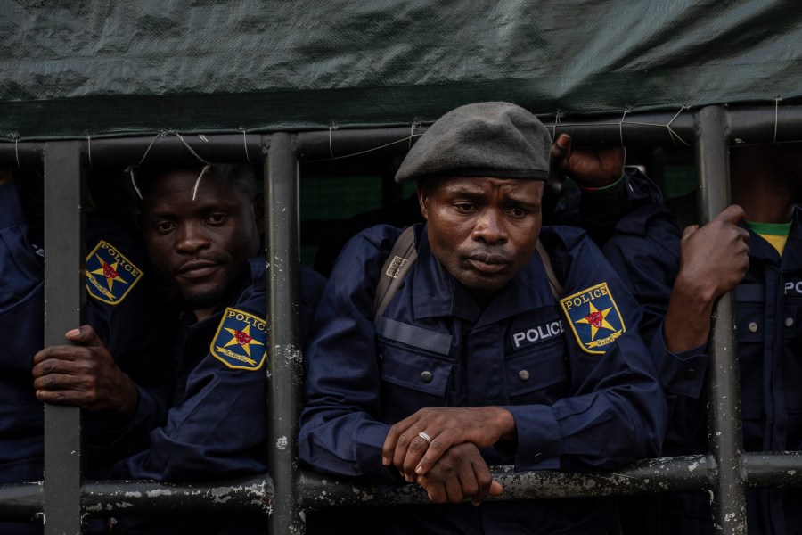 Former members of the Armed Forces of the Democratic Republic of Congo (FARDC) and police officers who allegedly surrendered to M23 rebels arrive in Goma, Congo, Sunday, Feb. 23, 2025. (AP Photo/Moses Sawasawa)