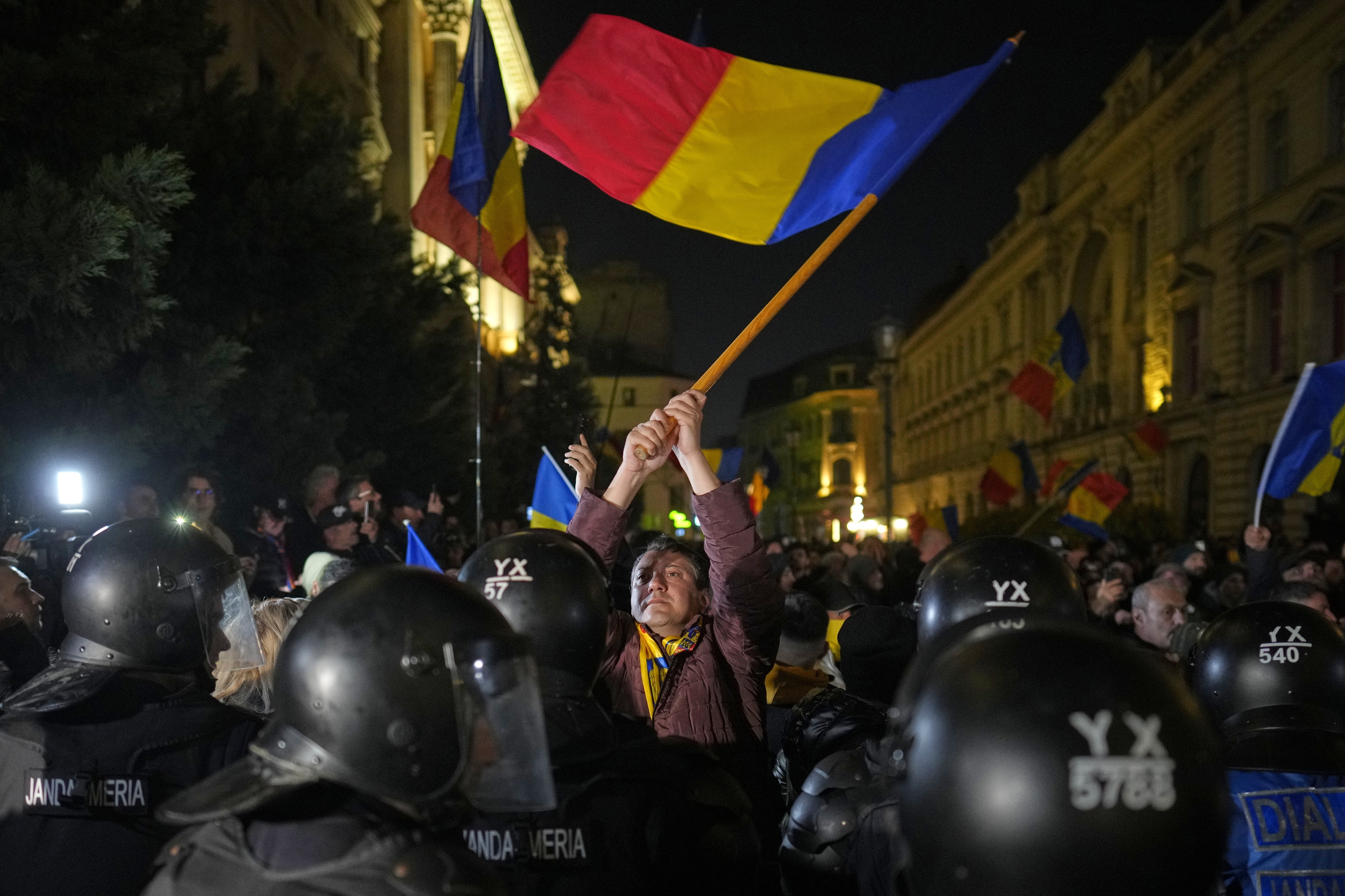 A supporter of Calin Georgescu reacts during a protest after Romania's electoral body rejected his candidacy in the presidential election rerun in Bucharest, Romania, Sunday, March 9, 2025. (AP Photo/Vadim Ghirda)