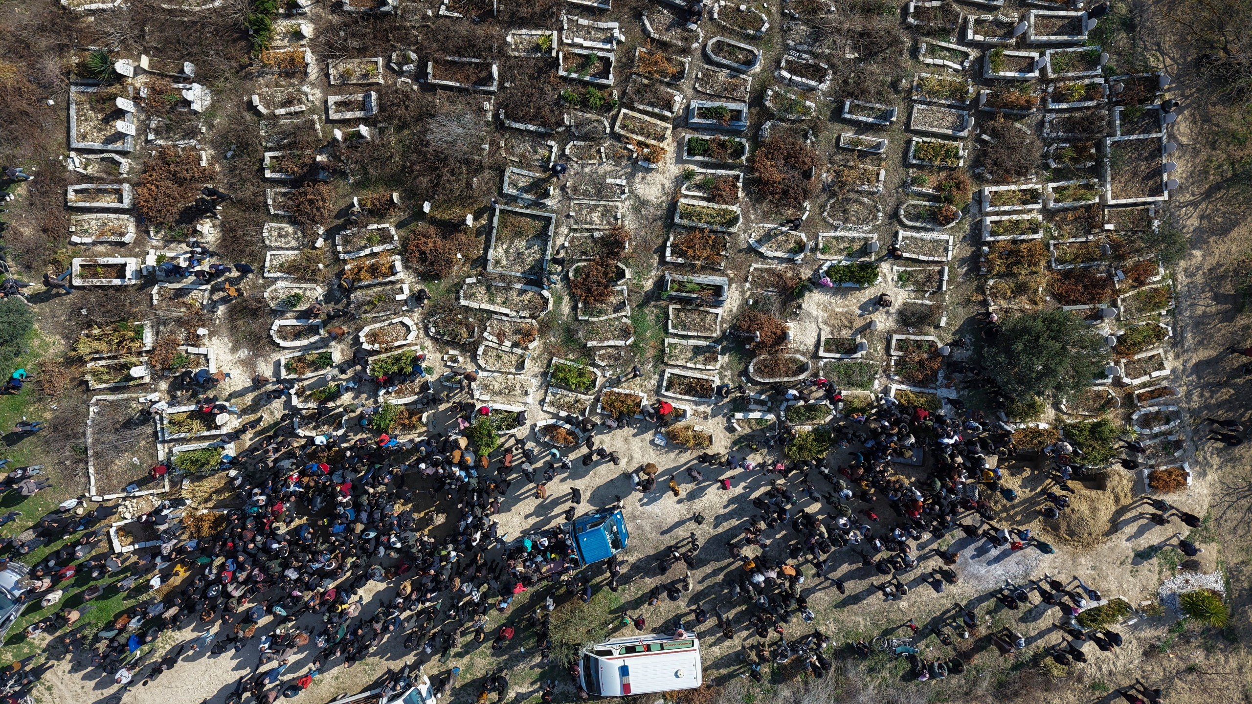 Relatives and neighbours attend the funeral procession for four Syrian security force members killed in clashes with loyalists of ousted President Bashar Assad in coastal Syria, in the village of Al-Janoudiya, west of Idlib, Saturday, March 8, 2025. (AP Photo/Omar Albam)