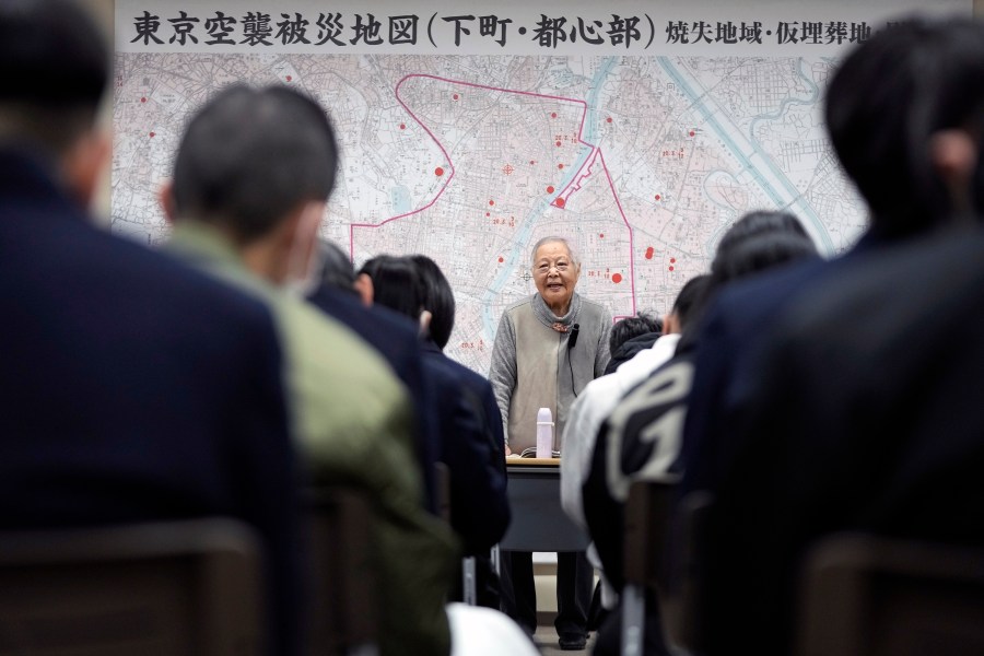 Shizuyo Takeuchi, 94-year-old Tokyo raid survivor, shares her experience in front of a map of the areas damaged during the 1945 Tokyo Firebombing at the Center of the Tokyo Raids and War Damage on Feb. 24, 2025, in Tokyo. (AP Photo/Eugene Hoshiko)