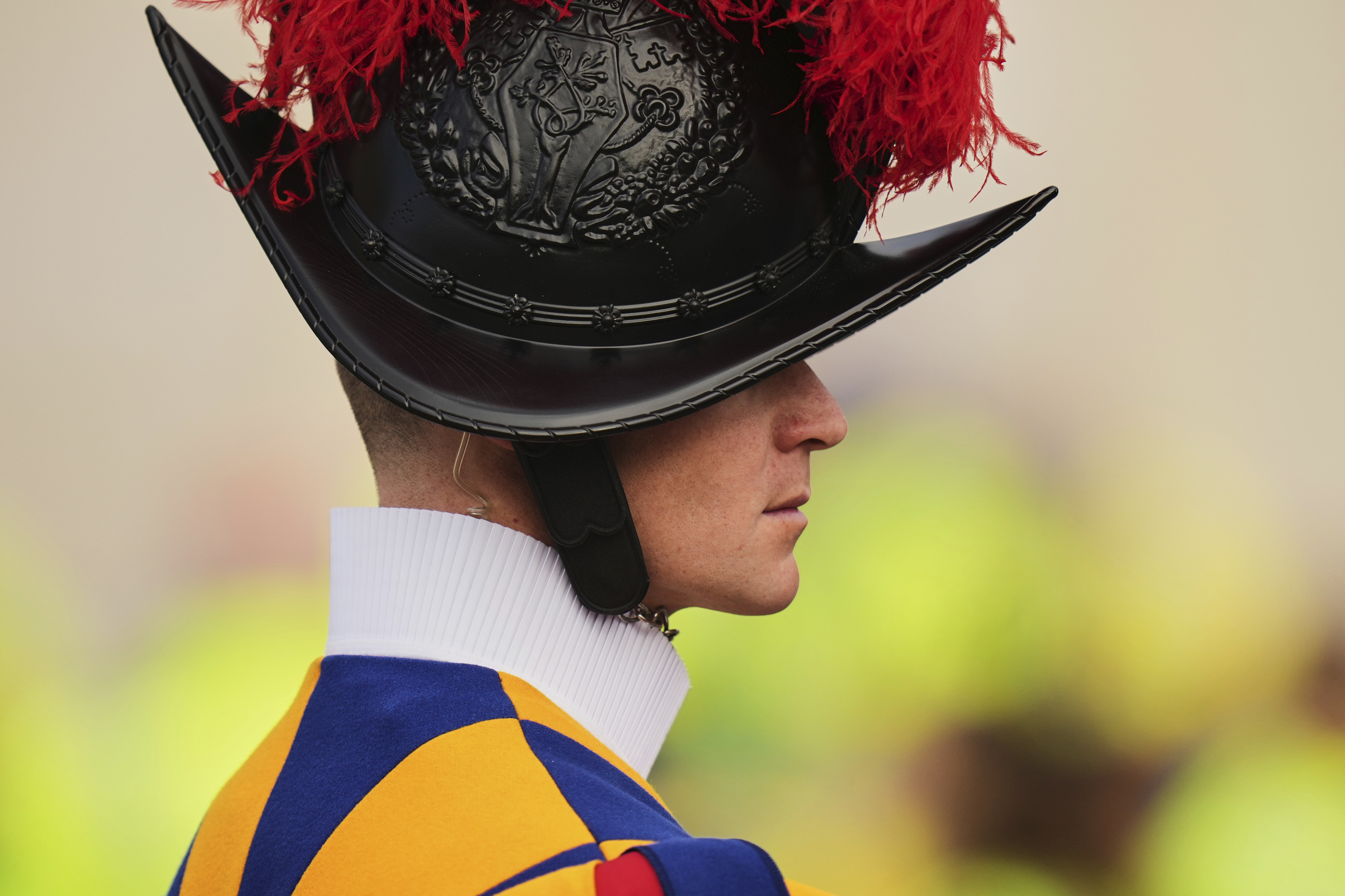 A Vatican Swiss guard stands prior to a mass for the world of volunteers led by delegate of Pope Francis Cardinal Michael Czerny in St. Peter's Square at The Vatican, Sunday, March 9, 2025. (AP Photo/Francisco Seco)