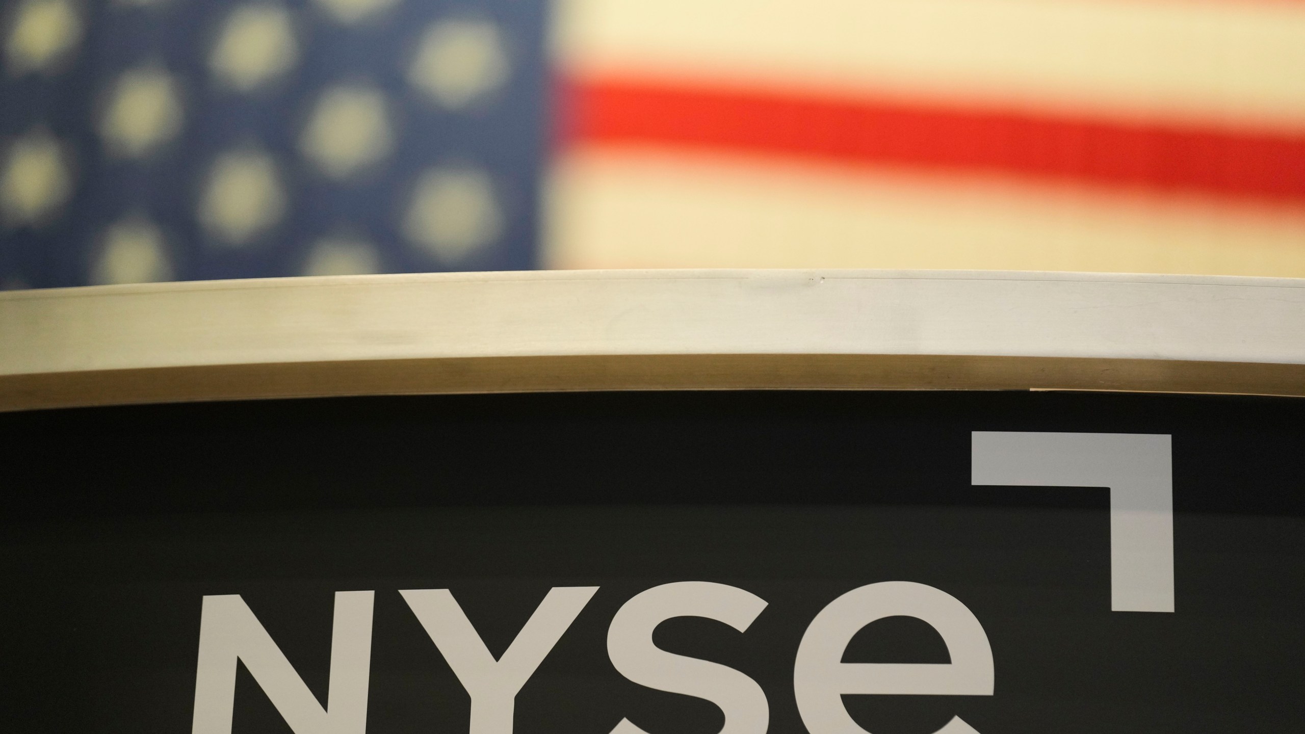 FILE - An NYSE sign is displayed on the floor at the New York Stock Exchange in New York, Thursday, Jan. 2, 2025. (AP Photo/Seth Wenig, File)