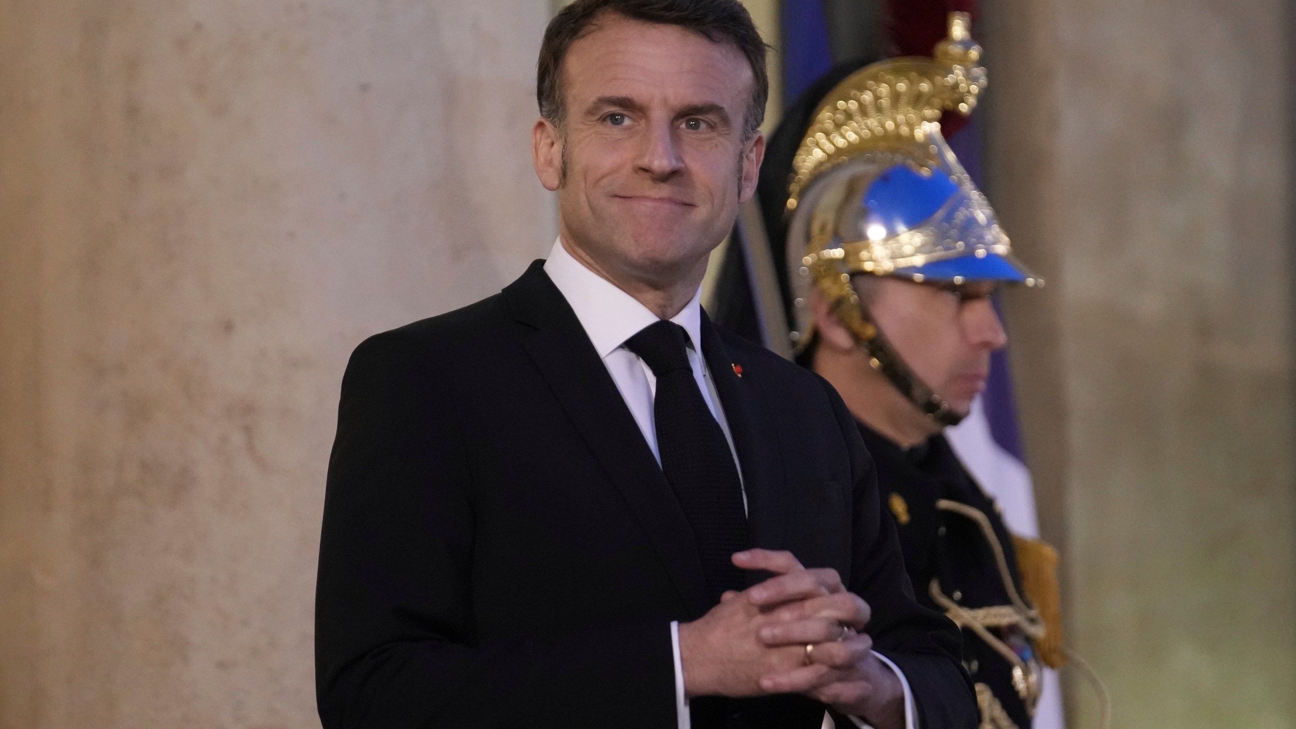 French President Emmanuel Macron waits for Moldova's President Maia Sandu Monday, March 10, 2025 at the Elysee Palace in Paris. (AP Photo/Christophe Ena)