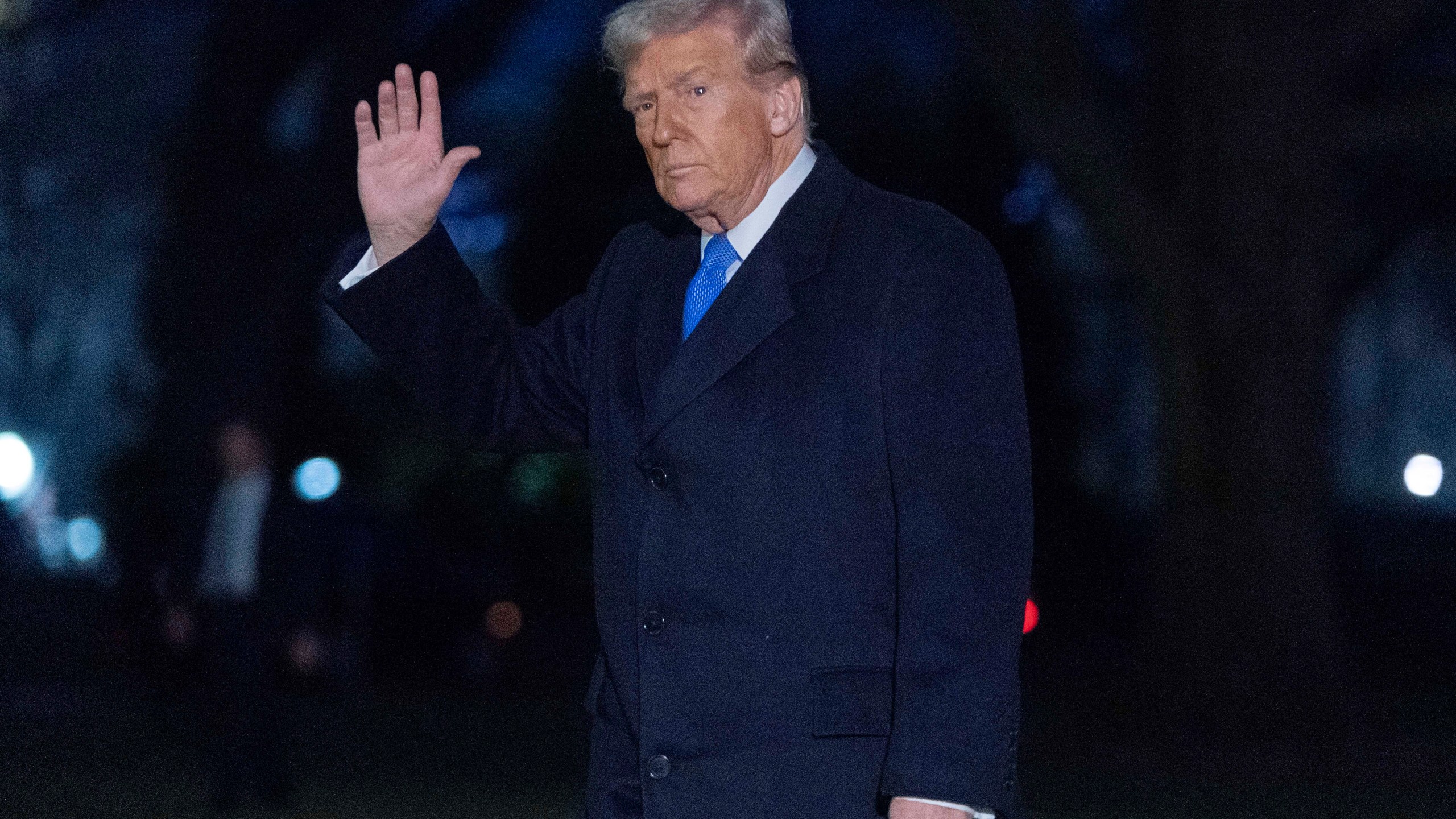 President Donald Trump waves to the media as he walks on South Lawn of the White House, in Washington, Sunday, March 9, 2025. (AP Photo/Jose Luis Magana)