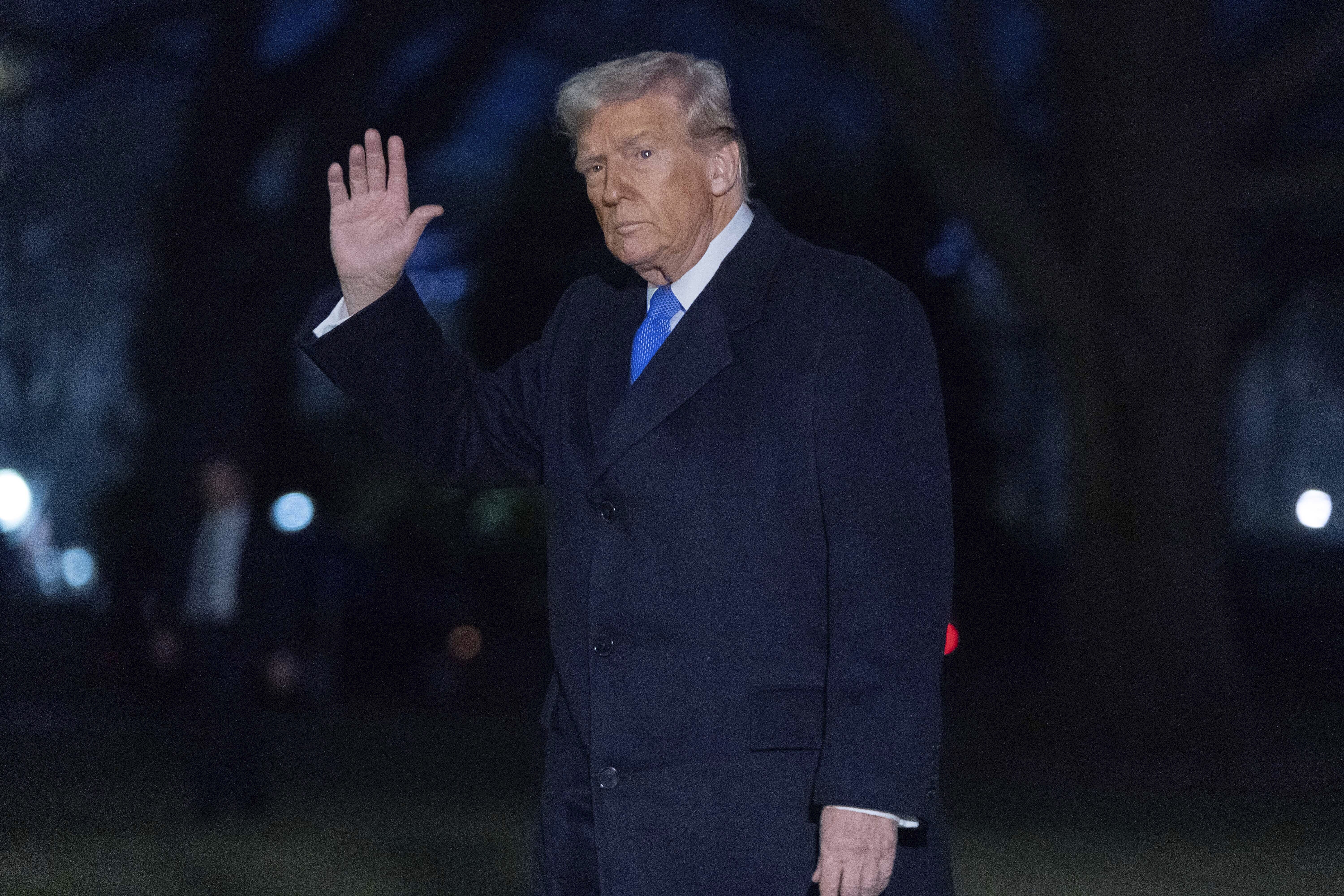 President Donald Trump waves to the media as he walks on South Lawn of the White House, in Washington, Sunday, March 9, 2025. (AP Photo/Jose Luis Magana)