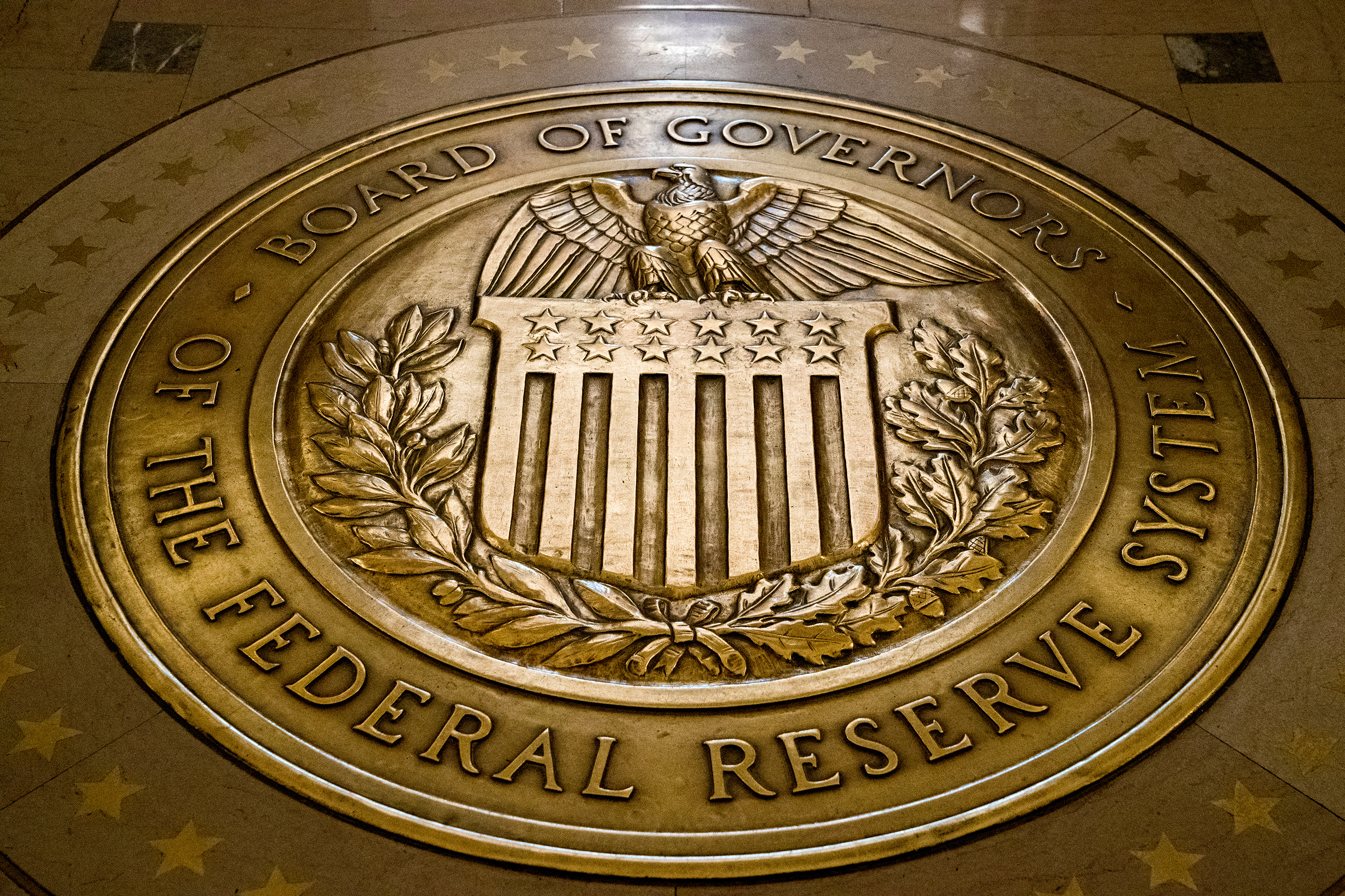 FILE - The seal of the Board of Governors of the United States Federal Reserve System is displayed in the ground at the Marriner S. Eccles Federal Reserve Board Building in Washington, Feb. 5, 2018. (AP Photo/Andrew Harnik, File)