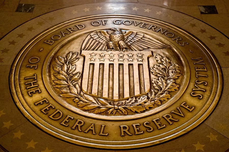 FILE - The seal of the Board of Governors of the United States Federal Reserve System is displayed in the ground at the Marriner S. Eccles Federal Reserve Board Building in Washington, Feb. 5, 2018. (AP Photo/Andrew Harnik, File)