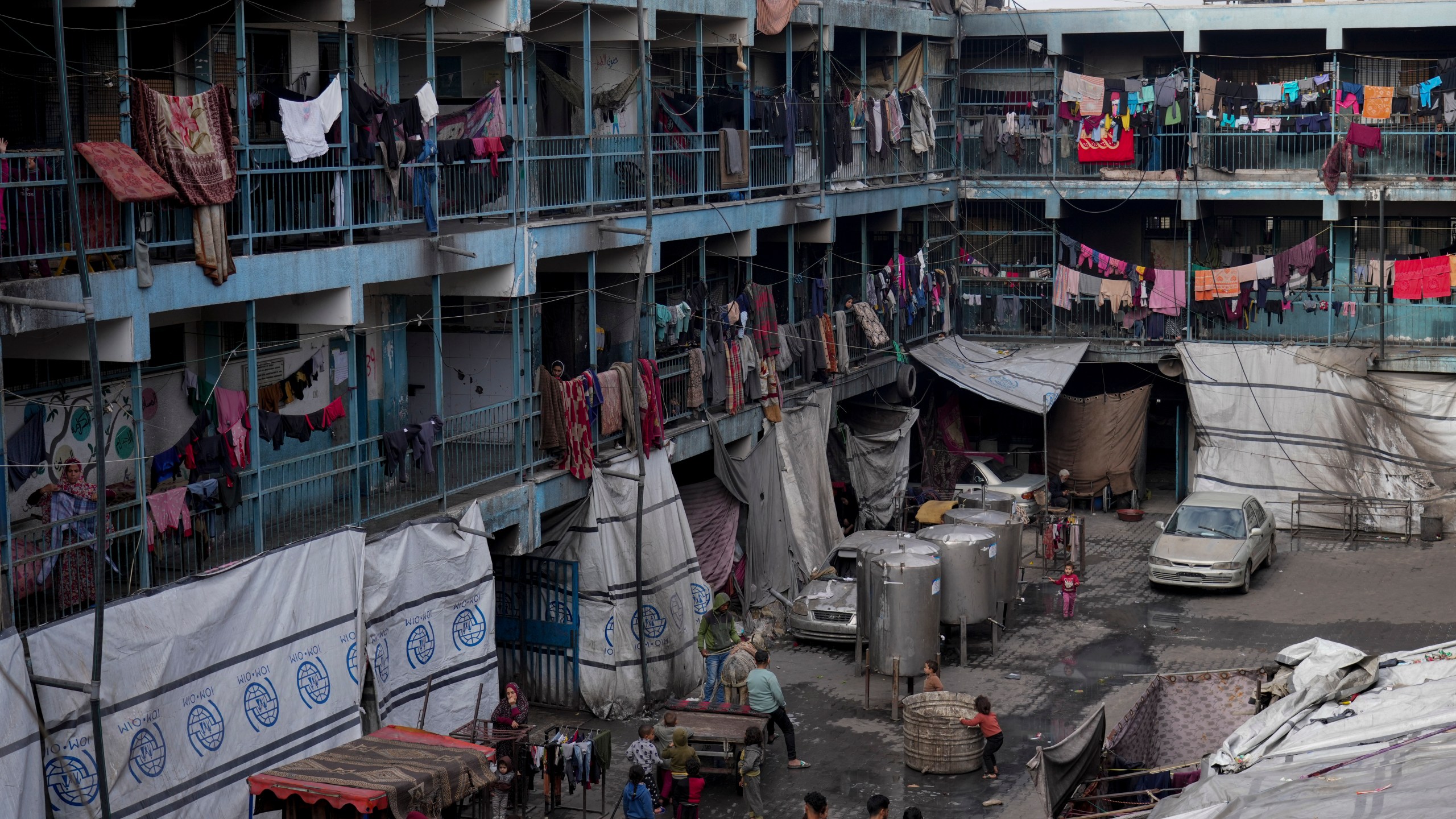 Displaced Palestinians lives in a school run by UNRWA, the U.N. agency helping Palestinian refugees, west of Gaza City, Sunday, March 9, 2025. (AP Photo/Jehad Alshrafi)