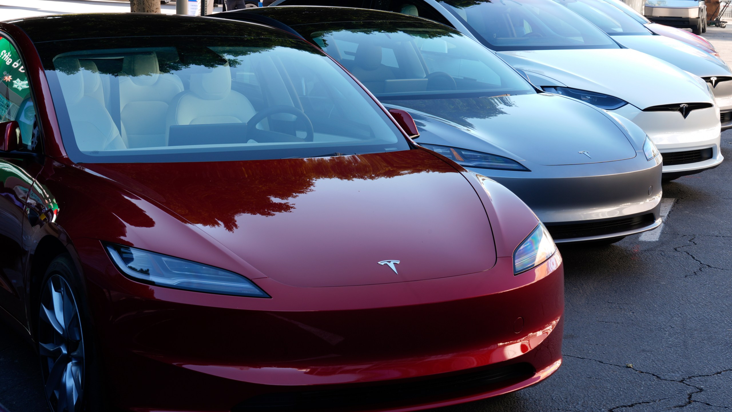 FILE - Tesla vehicles are displayed at the AutoMobility LA Auto Show, Thursday, Nov. 21, 2024, in Los Angeles. (AP Photo/Damian Dovarganes, File)