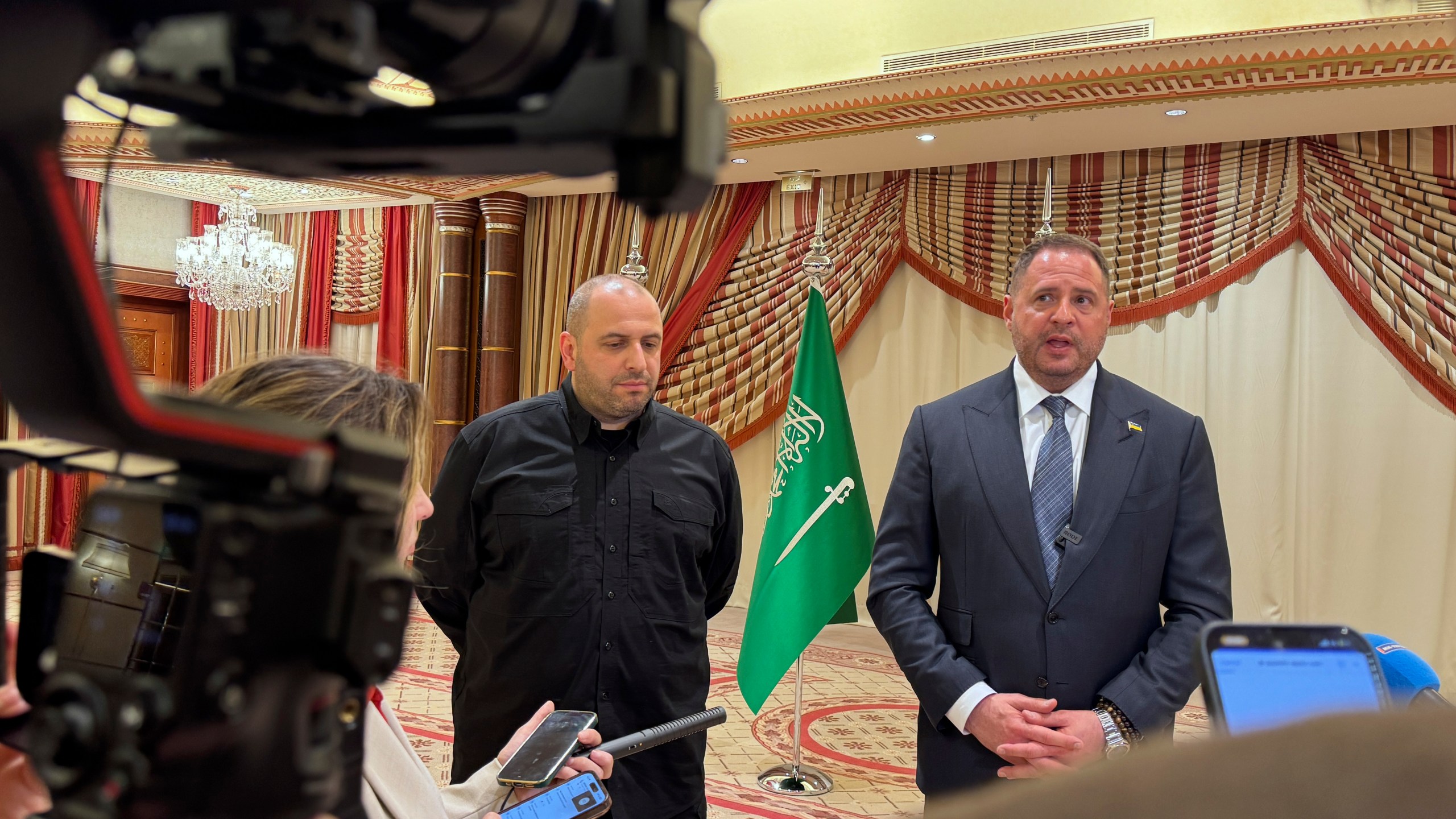 Ukrainian Head of Presidential Office Andriy Yermak, right, and Ukrainian Minister of Defense Rustem Umerov speak to journalists in Jeddah, Saudi Arabia, Tuesday, March 11, 2025. (AP Photo/Baraa Anwer)