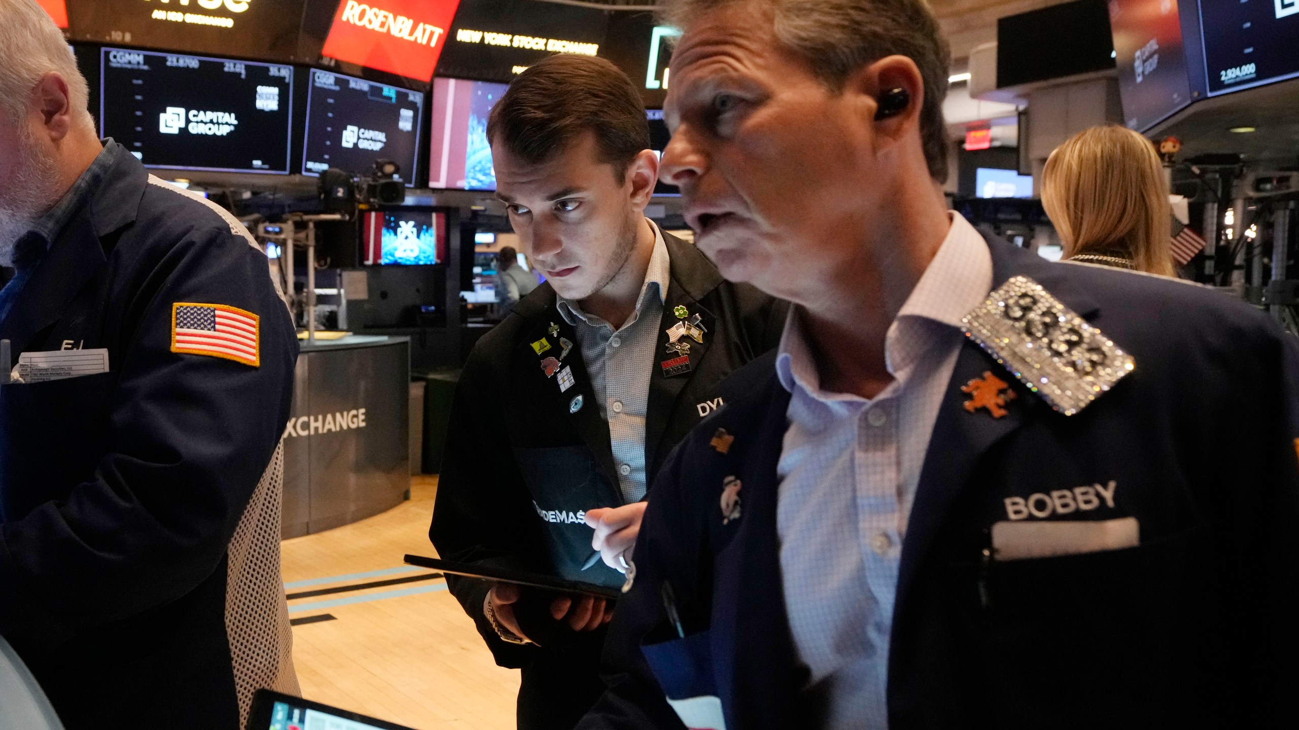 Traders work on the floor of the New York Stock Exchange, Tuesday, March 11, 2025. (AP Photo/Richard Drew)