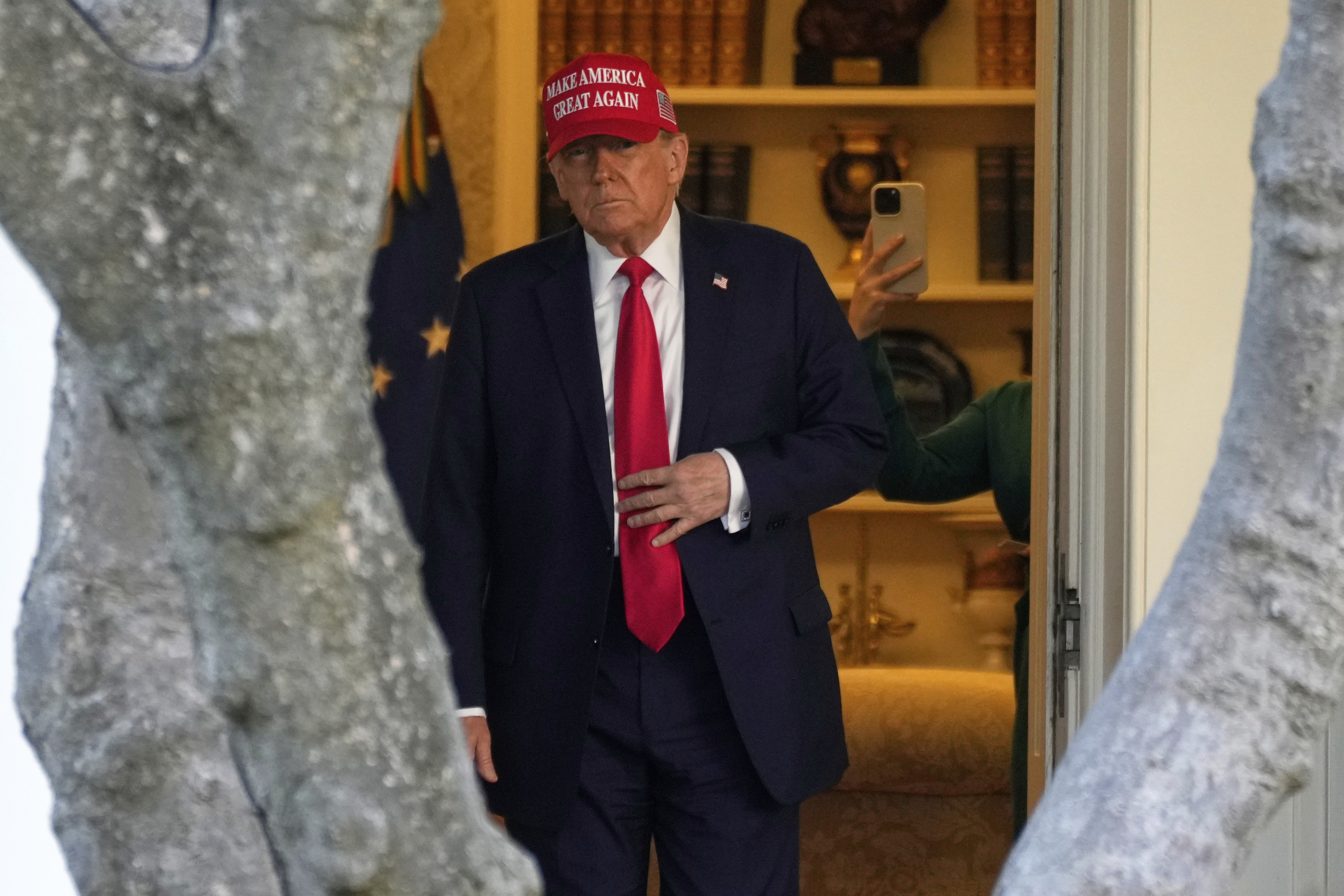 FILE - President Donald Trump walks from the Oval Office to depart on Marine One on the South Lawn of the White House in Washington, Feb. 28, 2025. (AP Photo/Ben Curtis, File)