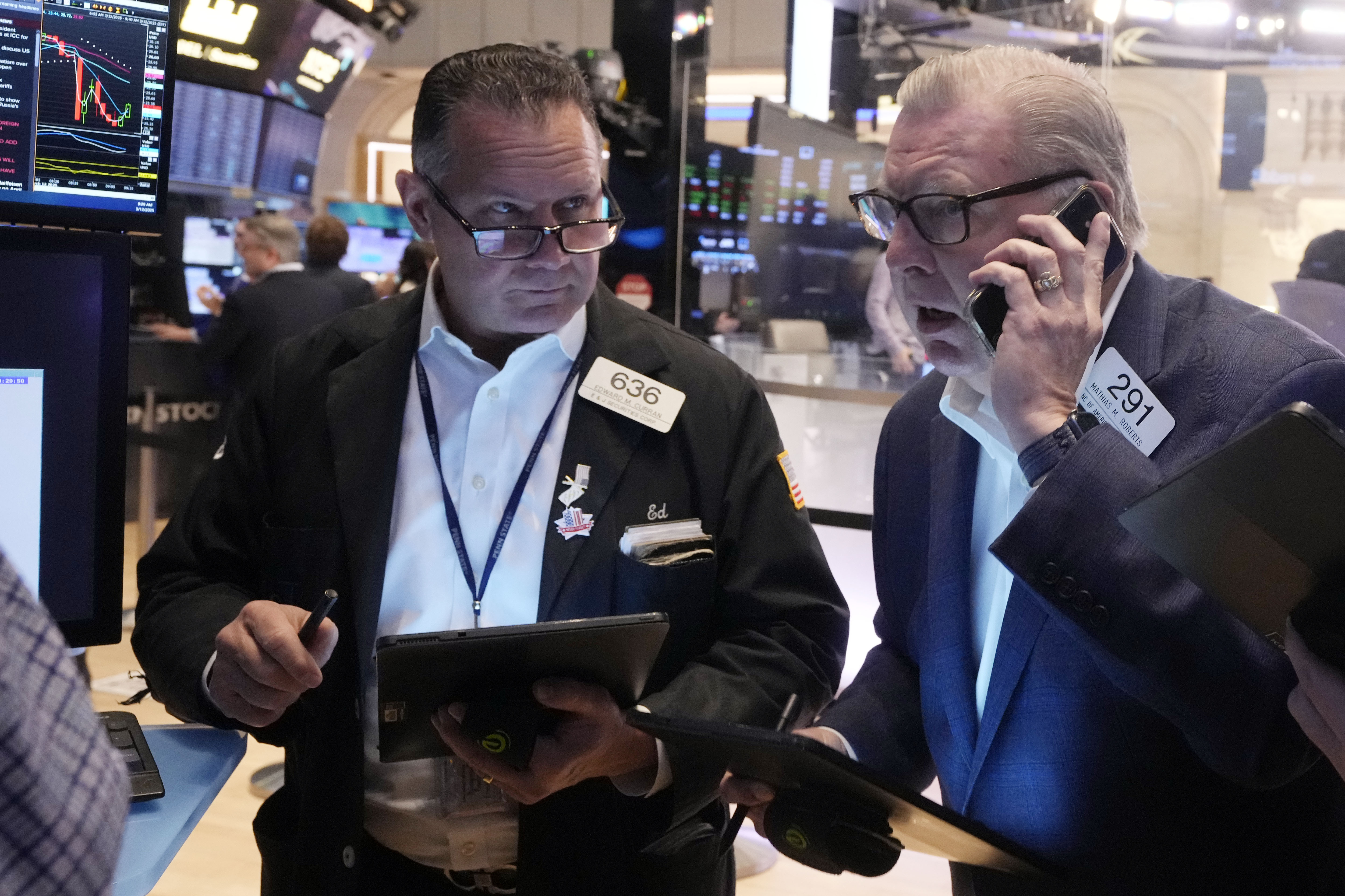 Traders work on the floor of the New York Stock Exchange, Wednesday, March 12, 2025. (AP Photo/Richard Drew)