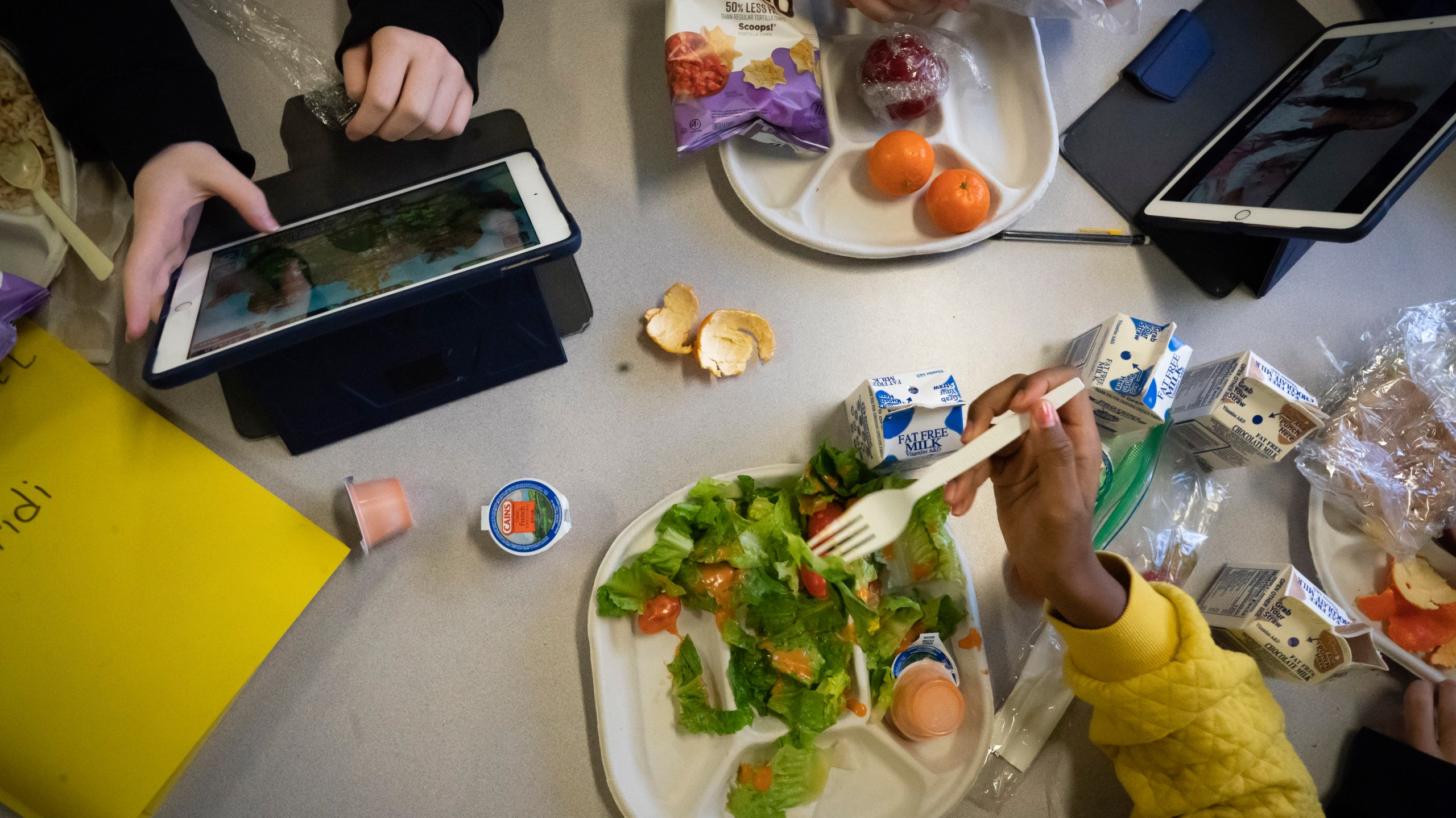 FILE - Seventh graders sit together in the cafeteria during their lunch break at a public school, Friday, Feb. 10, 2023, in the Brooklyn borough of New York. (AP Photo/Wong Maye-E, File)