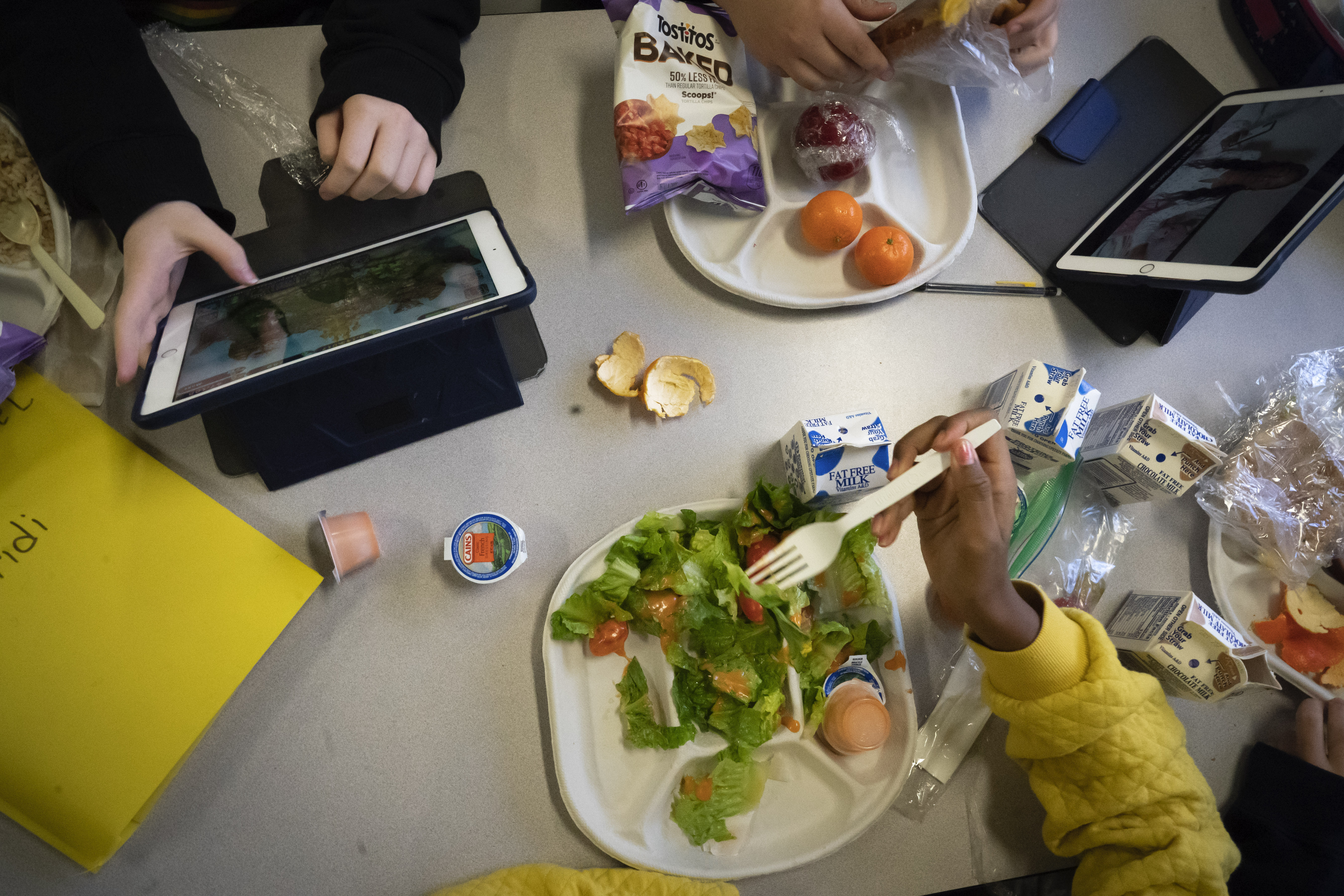 FILE - Seventh graders sit together in the cafeteria during their lunch break at a public school, Friday, Feb. 10, 2023, in the Brooklyn borough of New York. (AP Photo/Wong Maye-E, File)