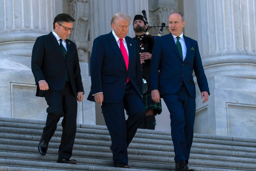 President Donald Trump, center, accompanied by Speaker of the House Mike Johnson, R-La., left, and Ireland's Prime Minister Micheal Martin, walks down the stairs of the U.S. Caopitol, after a luncheon on Wednesday, March 12, 2025, in Washington. (AP Photo/Jose Luis Magana)