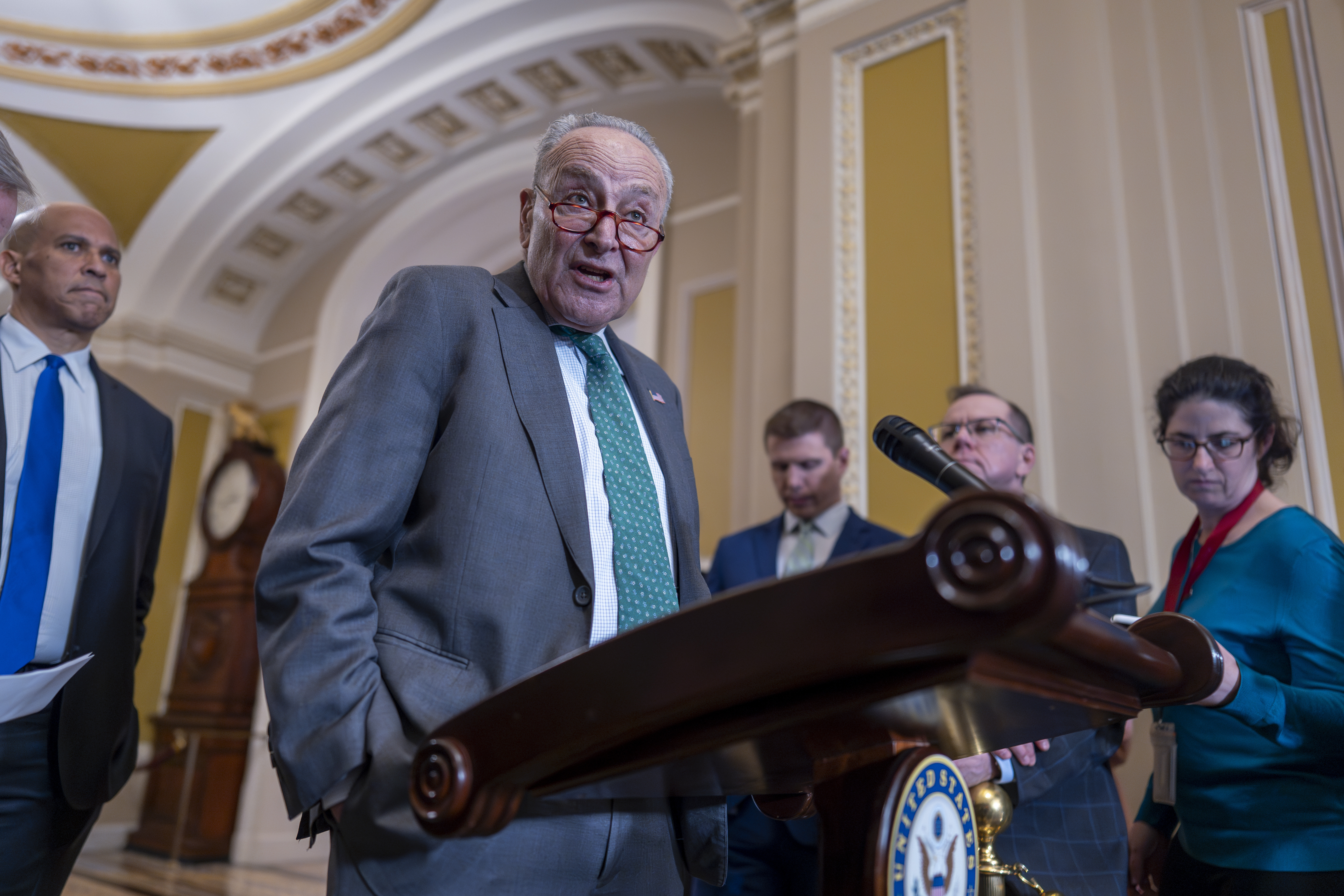 Senate Minority Leader Chuck Schumer, D-N.Y., speaks with reporters as Republicans work to pass an interim spending bill that would avoid a partial government shutdown and keep federal agencies funded through September, at the Capitol in Washington, Tuesday, March 11, 2025. (AP Photo/J. Scott Applewhite)