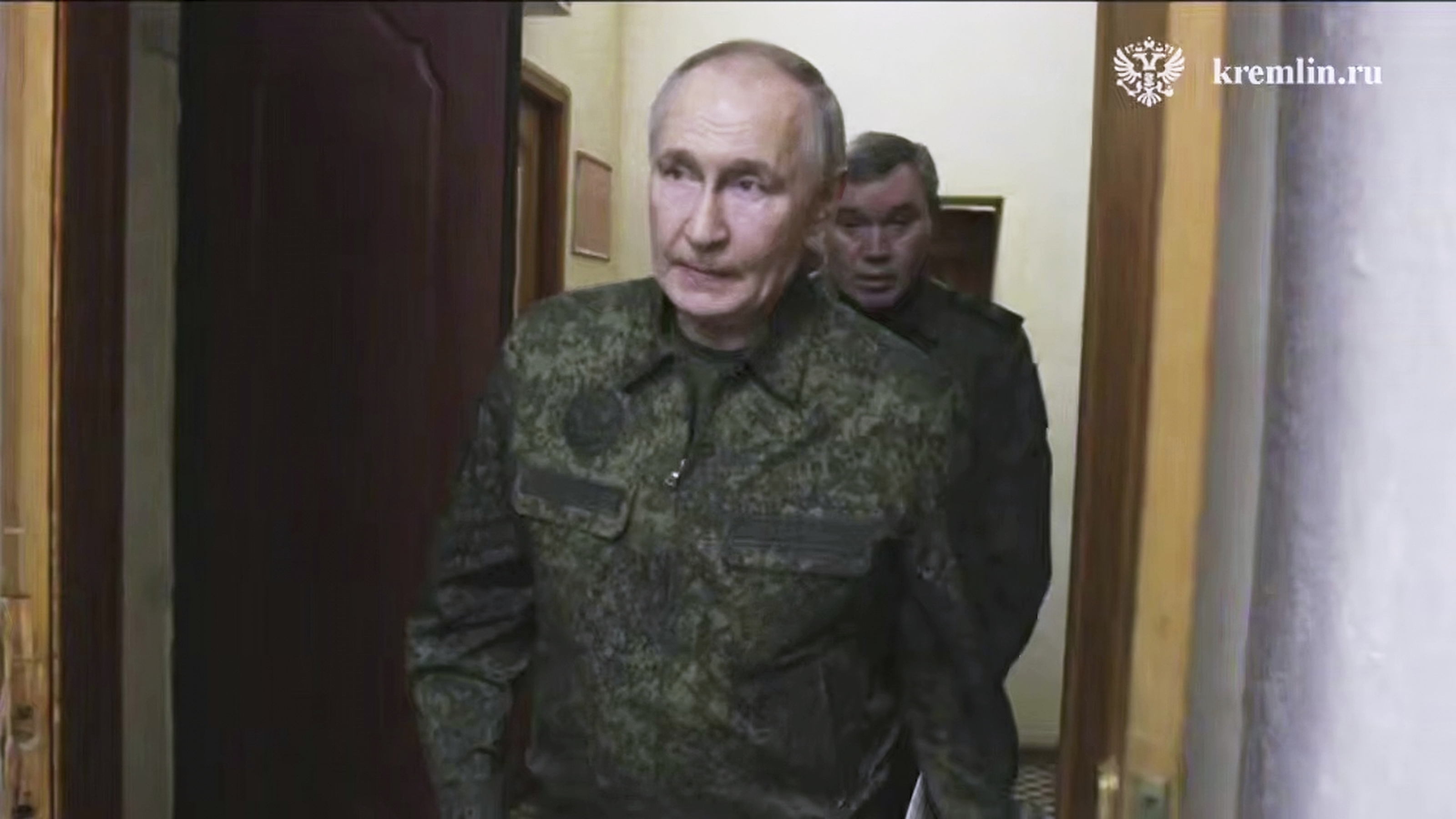 In this image made from video released by the Russian Presidential Press Service, on Wednesday, March 12, 2025, Russian President Vladimir Putin accompanied by Russian Chief of General Staff Gen. Valery Gerasimov, behind Putin, visits military headquarters in the Kursk region of Russia. (Russian Presidential Press Service via AP)