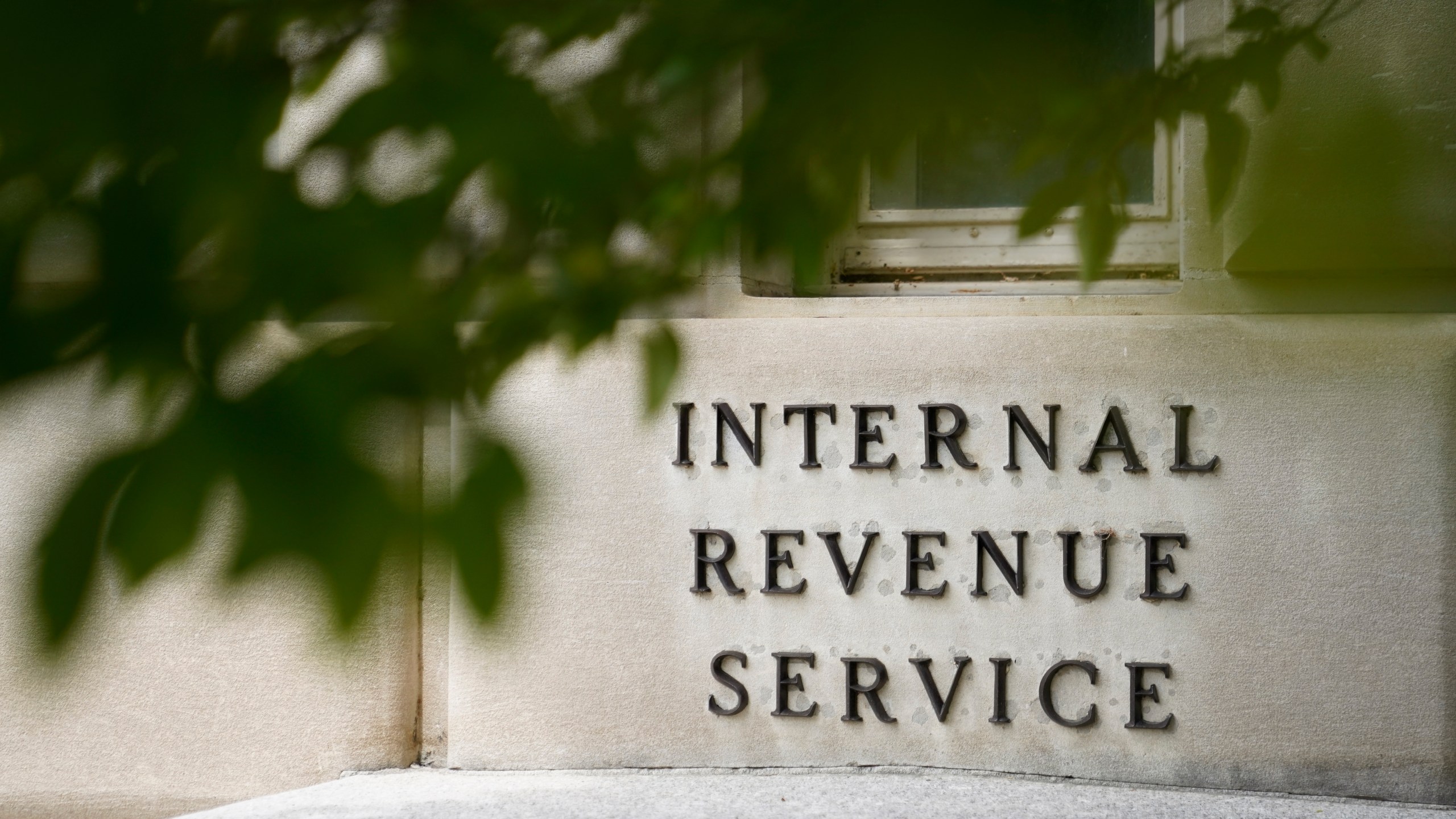 FILE - The sign outside the Internal Revenue Service building is seen. May 4, 2021, in Washington. (AP Photo/Patrick Semansky, File)