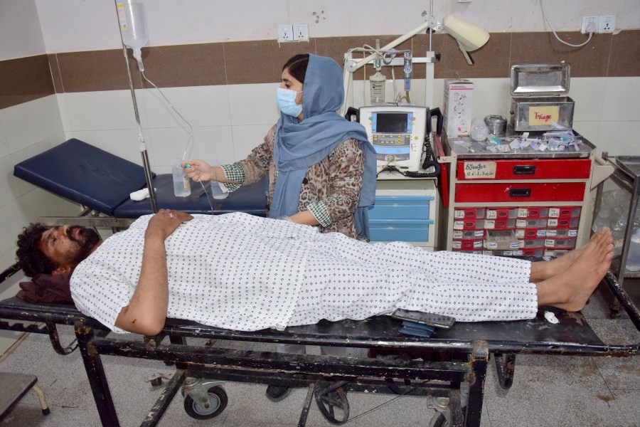 An injured victim of a passenger train attacked by insurgents, receives treatment upon arrival at a hospital in Quetta, Pakistan's southwestern Balochistan province, Thursday March 13, 2025. (AP Photo/Arshad Butt)