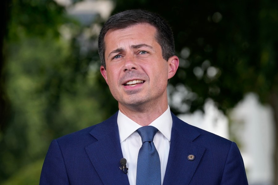 FILE - Transportation Secretary Pete Buttigieg talks with reporters at the White House in Washington, July 23, 2024. (AP Photo/Susan Walsh, FIle)