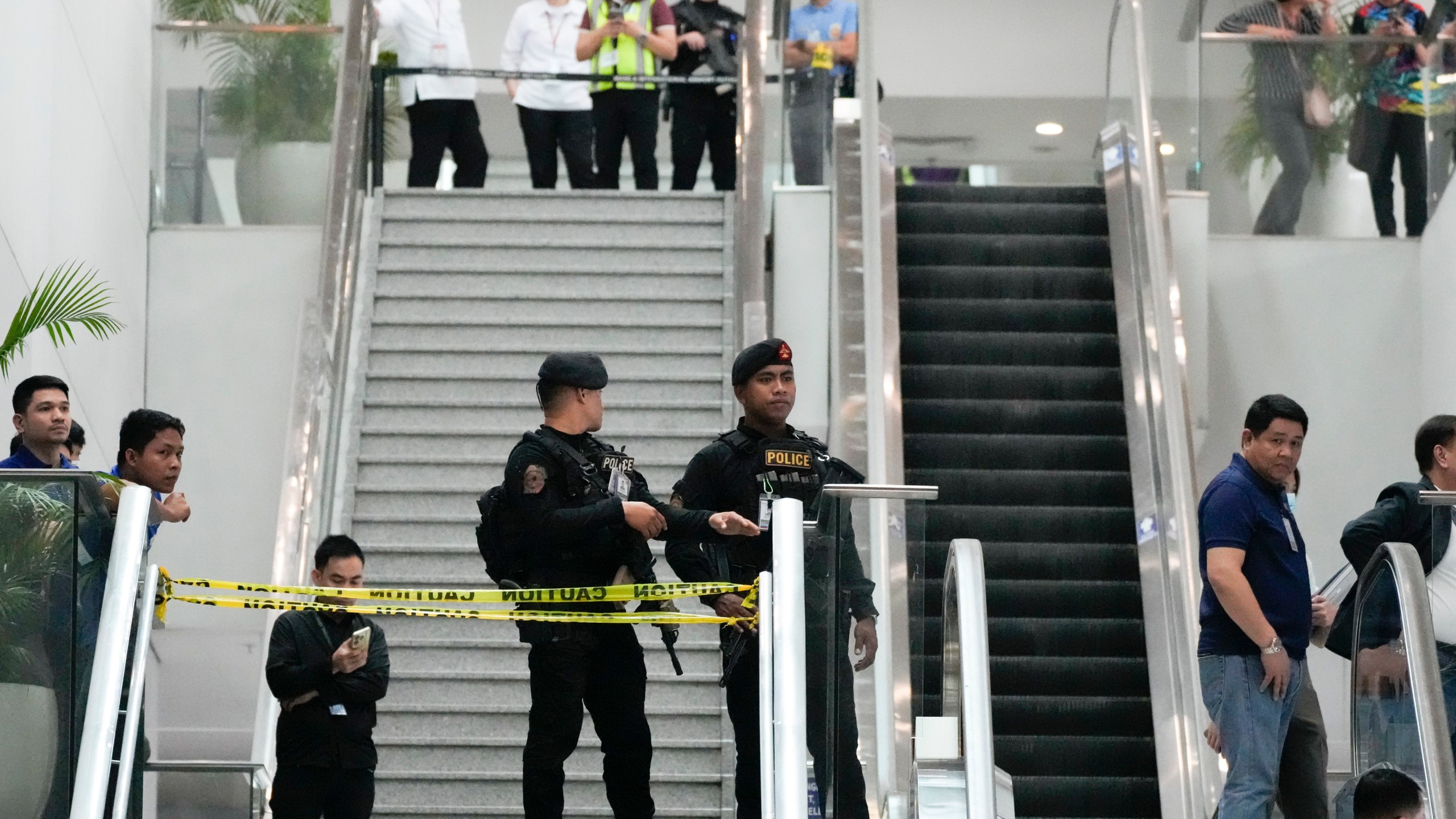 FILE - Armed police secure an area following the arrest of former Philippine President Rodrigo Duterte at the airport in Manila, Philippines on Tuesday, March 11, 2025. (AP Photo/Aaron Favila, File)