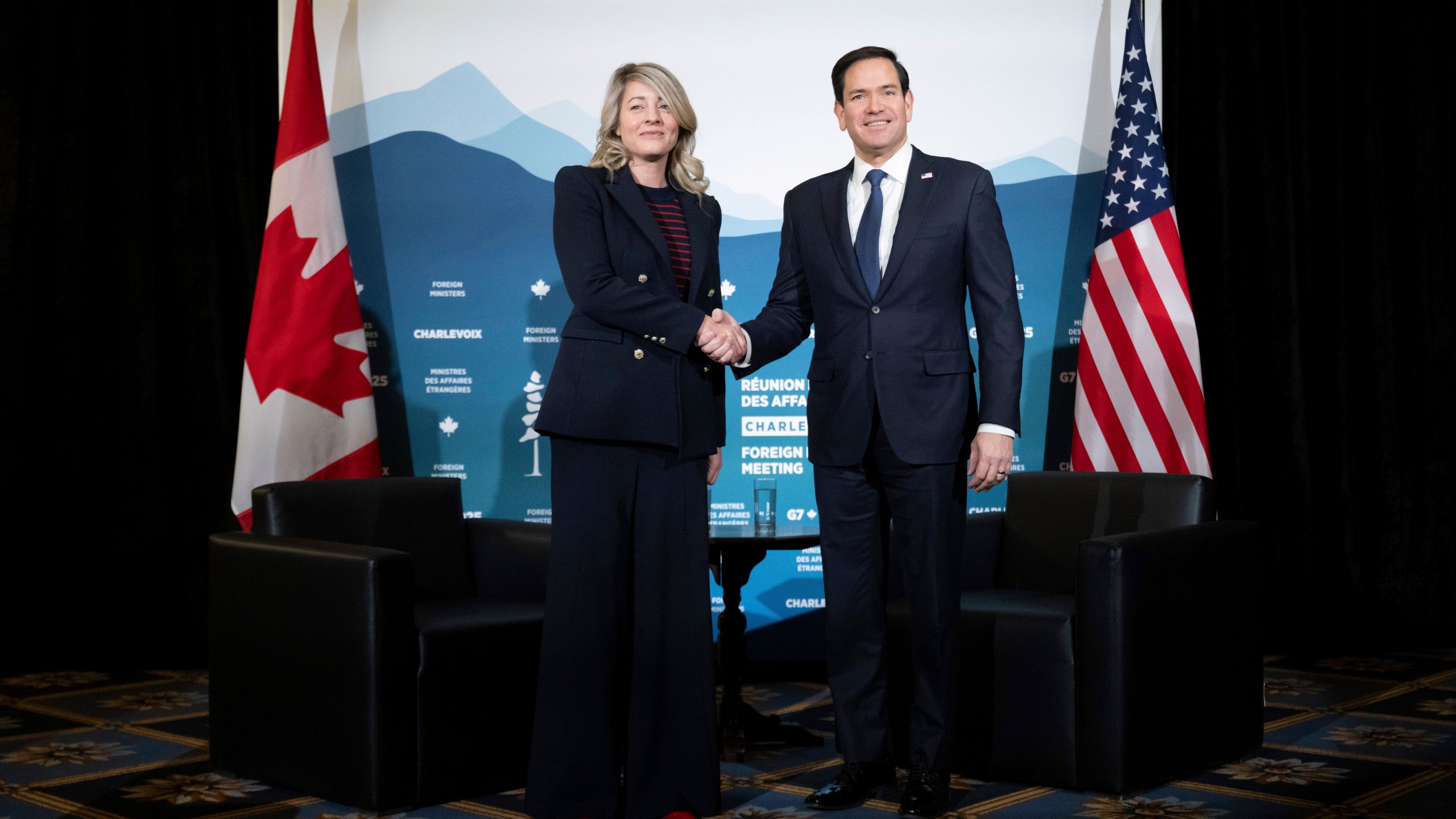 Canadian Foreign Minister Melanie Joly shakes hands with U.S. Secretary of State Marco Rubio during the G7 meeting of foreign ministers in Charlevoix, Quebec, Thursday, March 13, 2025. (Saul Loeb/Pool via AP)