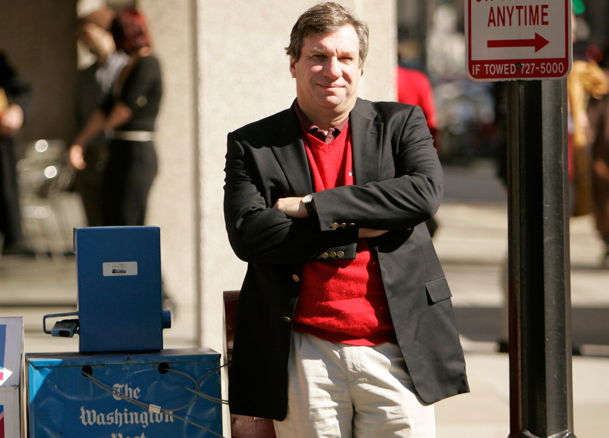 FILE - Sports writer and author John Feinstein poses in Washington, Feb. 28, 2006. (AP Photo Caleb Jones, file)