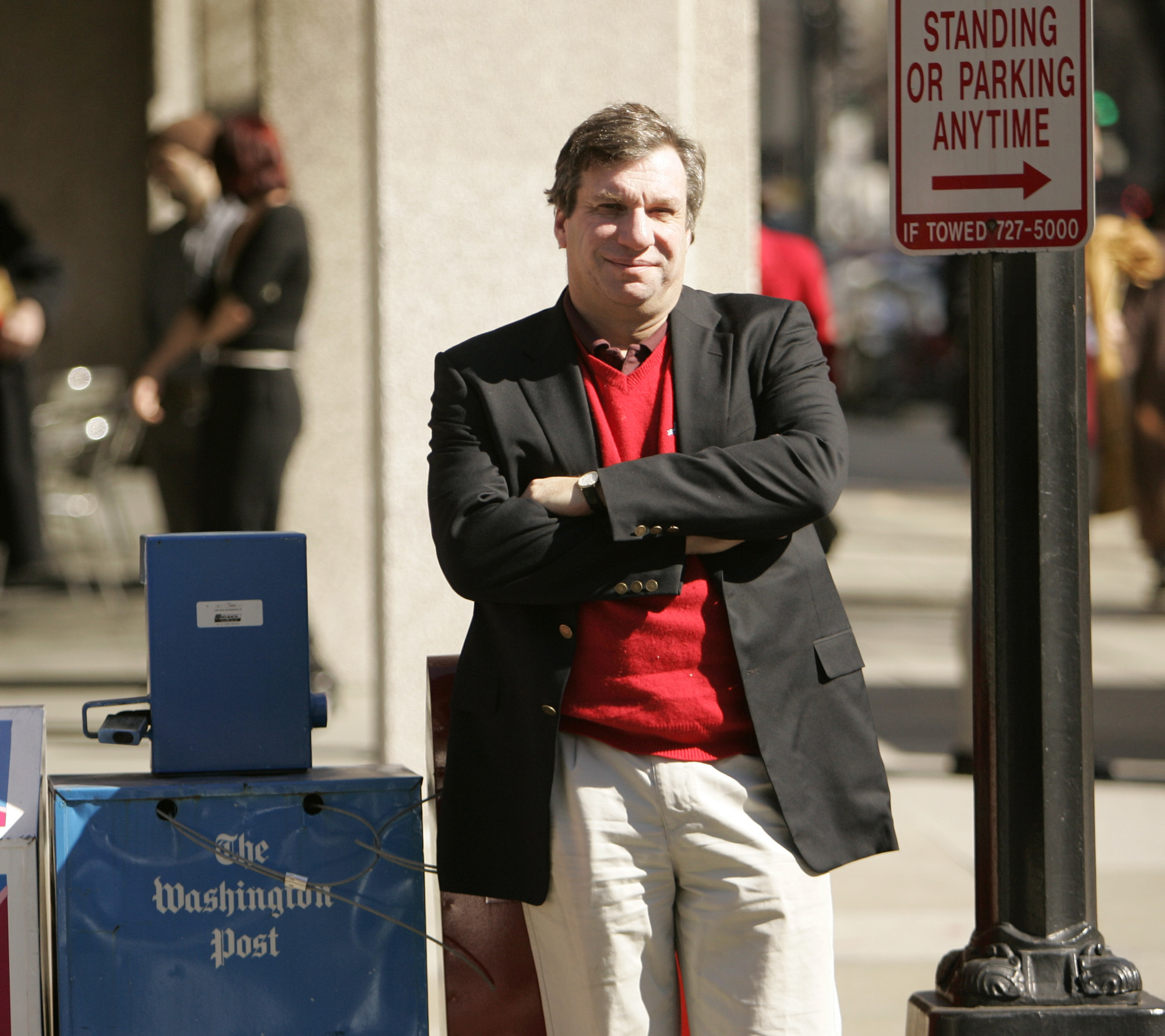 FILE - Sports writer and author John Feinstein poses in Washington, Feb. 28, 2006. (AP Photo Caleb Jones, file)