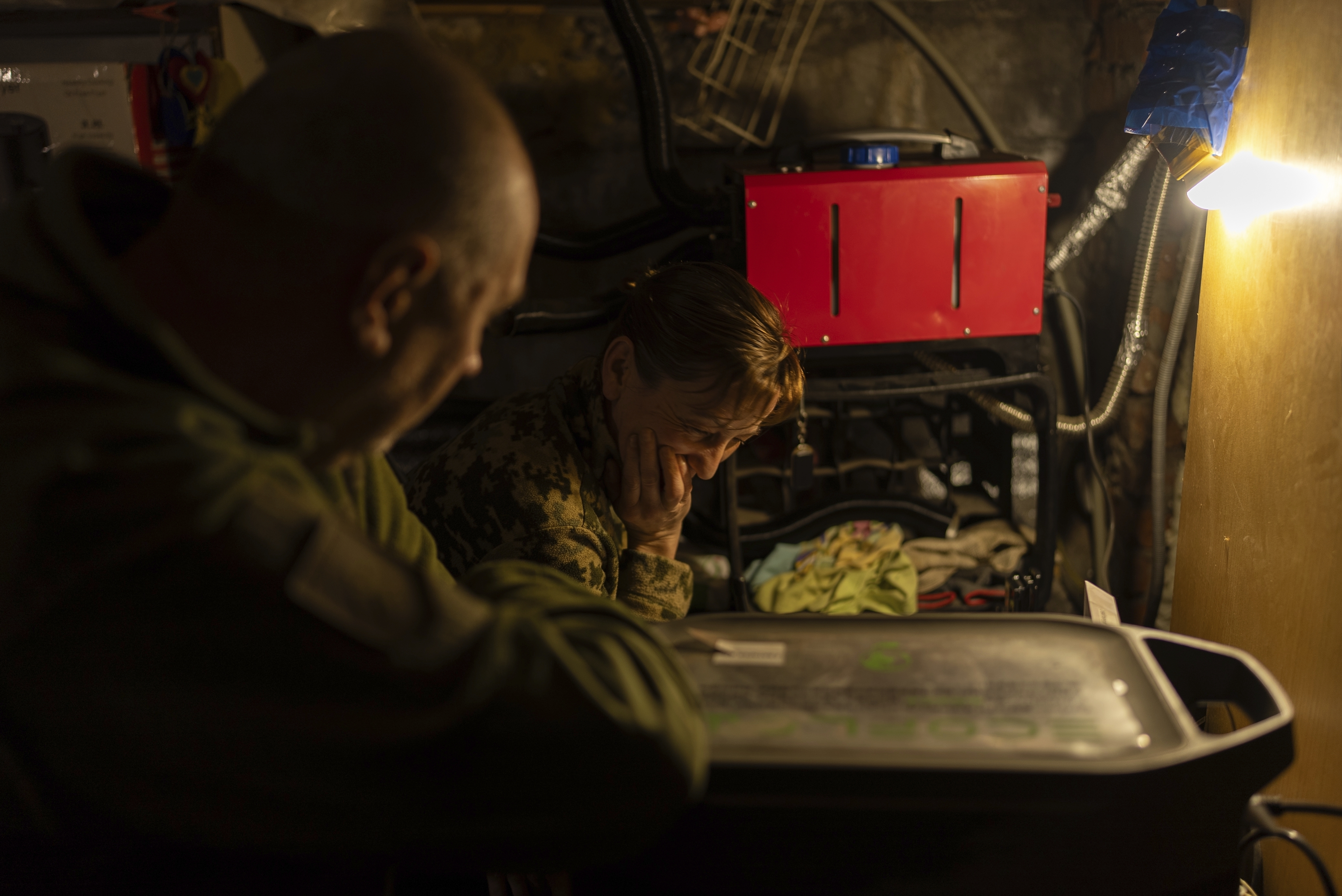 Ukrainian servicemen of Khartia brigade known by call signs "Stalker" (Left) and "Granata" (Right) are waiting for the order to fire towards Russian positions in Kharkiv region, Ukraine, Wednesday, March 12, 2025. (AP Photo/Alex Babenko)