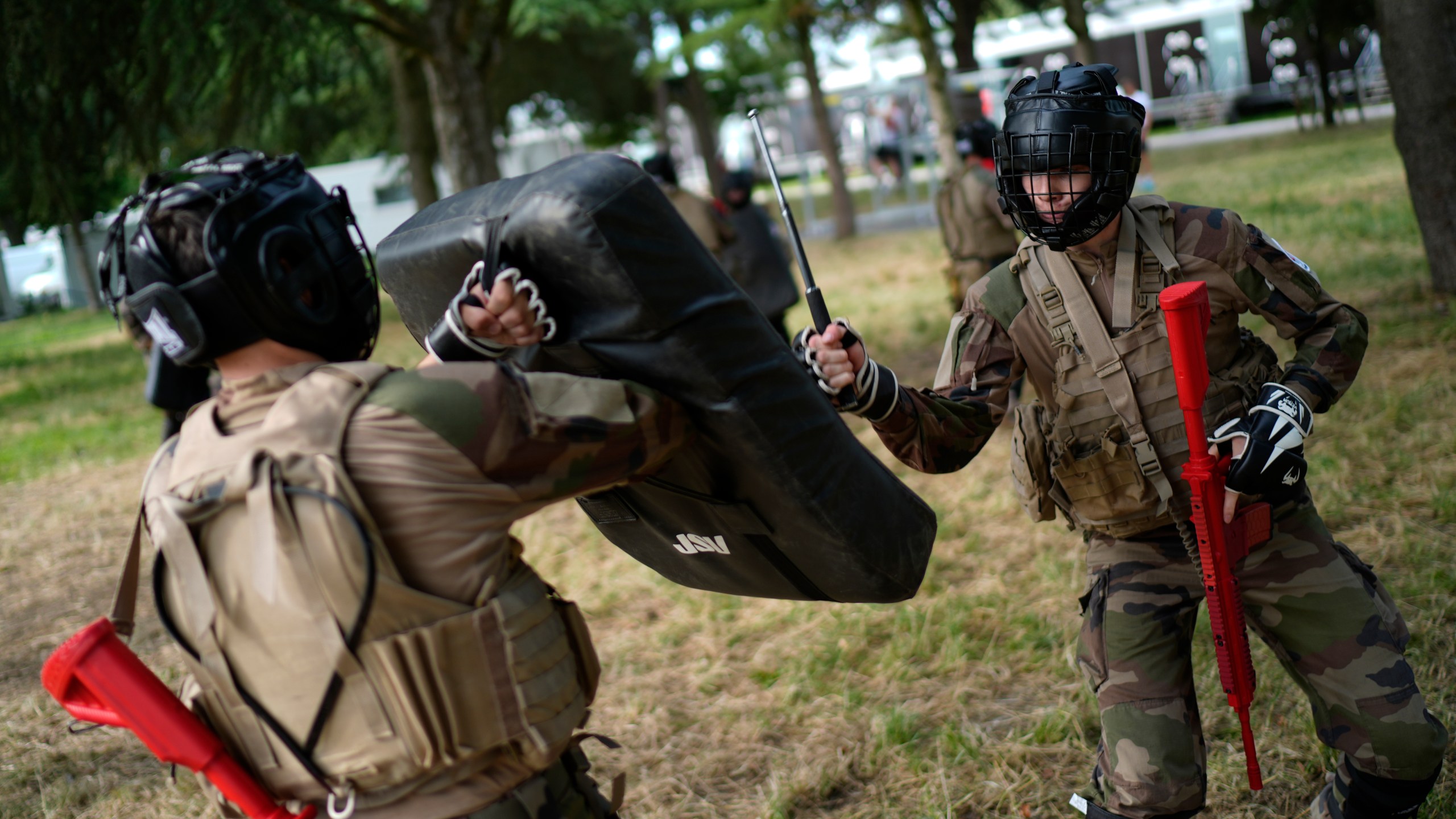 FILE - Soldiers demonstrate operational technics for close combat in a training class at a military camp set up for the Paris Olympic games, July 19, 2024, Vincennes, just outside Paris, France. (AP Photo/David Goldman, File)