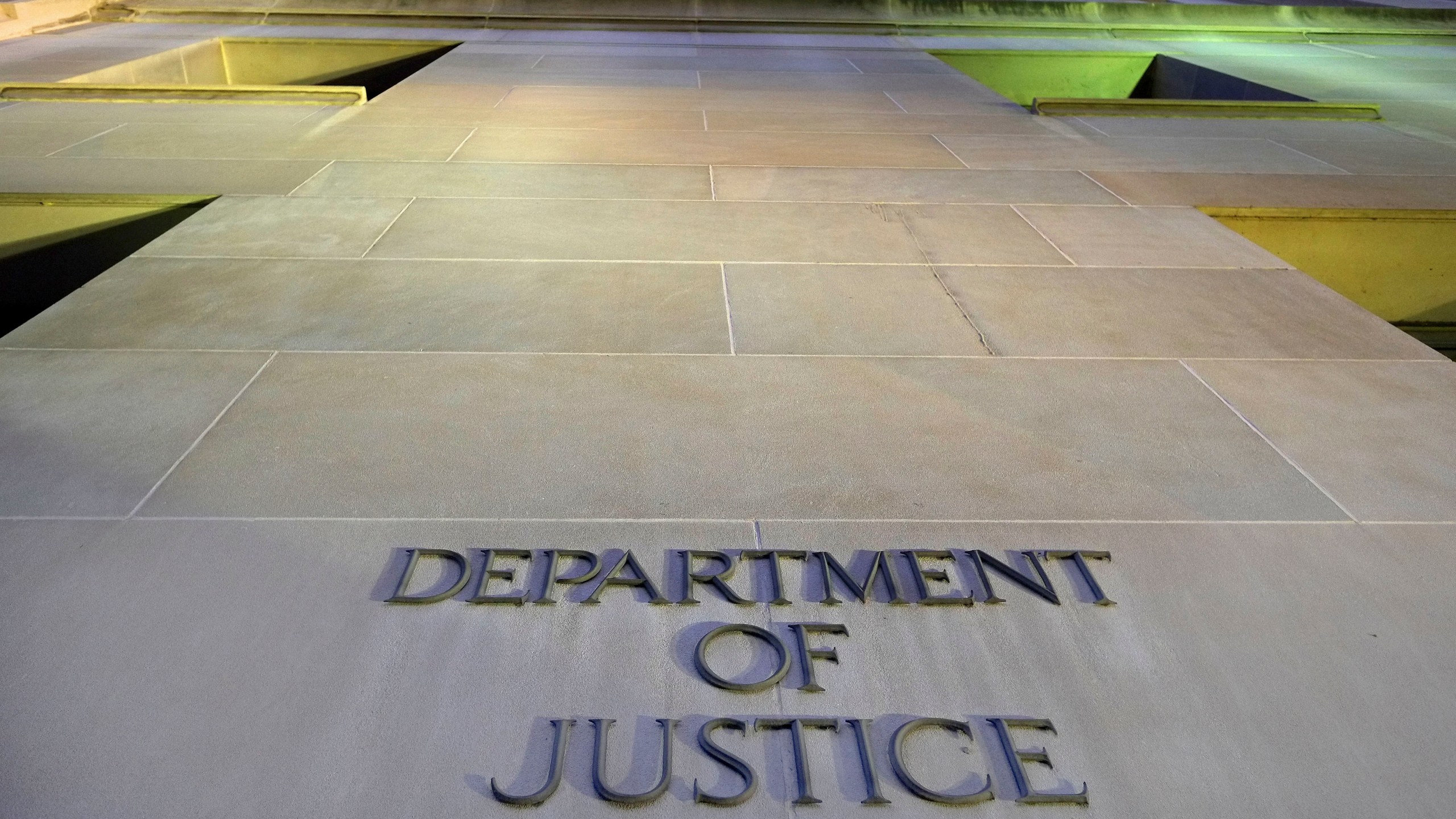 FILE - The Department of Justice headquarters building in Washington is photographed early in the morning, May 14, 2013. (AP Photo/J. David Ake, File)