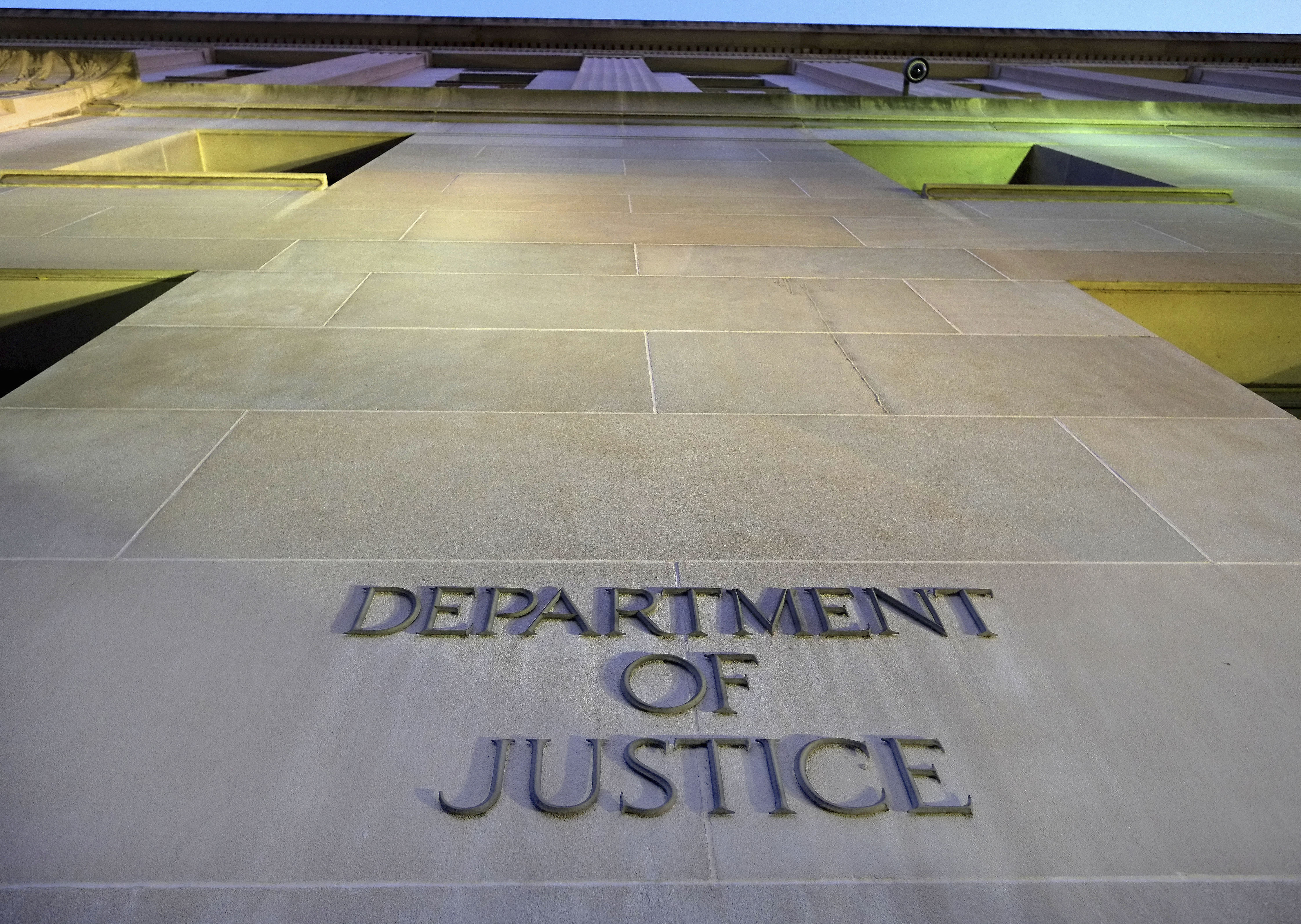 FILE - The Department of Justice headquarters building in Washington is photographed early in the morning, May 14, 2013. (AP Photo/J. David Ake, File)